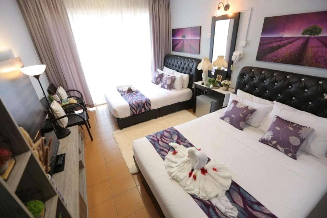 Bed in Ghazrin's Garuda Hotel