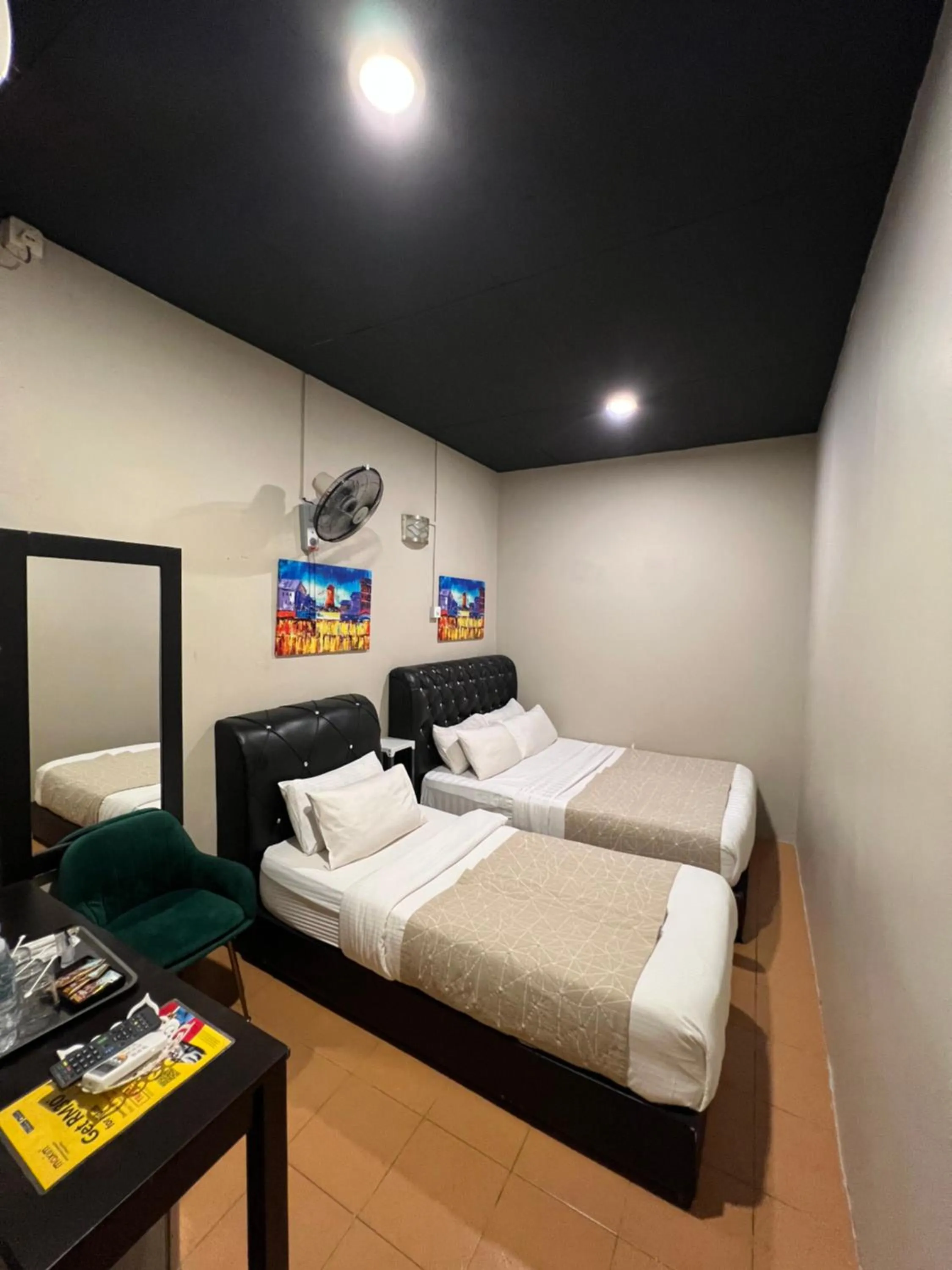 Bed in Ghazrin's Garuda Hotel