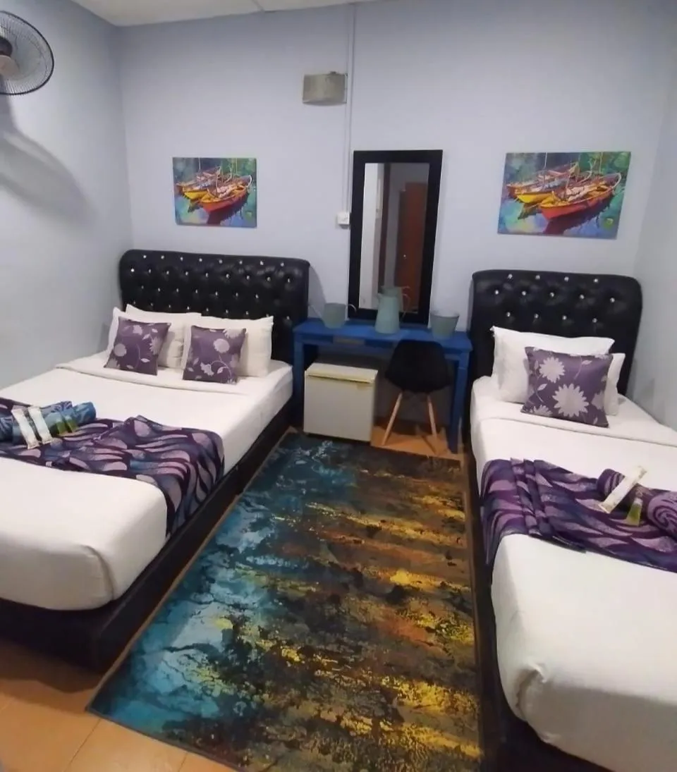 Bed in Ghazrin's Garuda Hotel