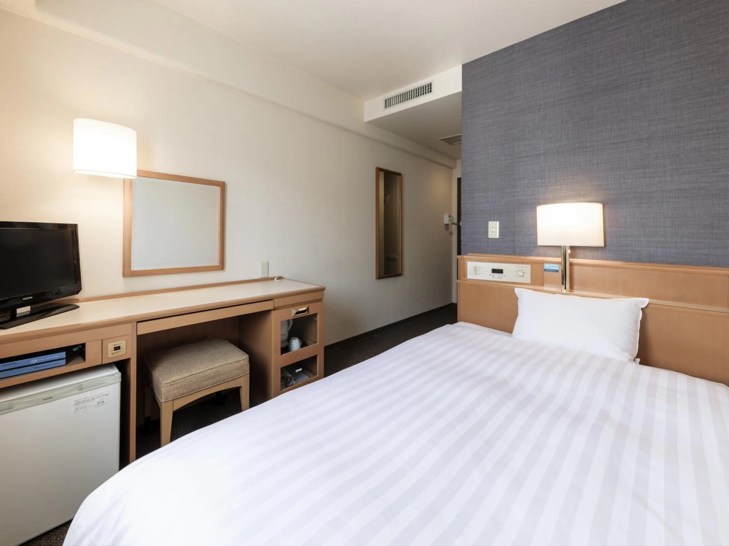 Photo of the whole room, Bed in Nishitetsu Inn Tenjin