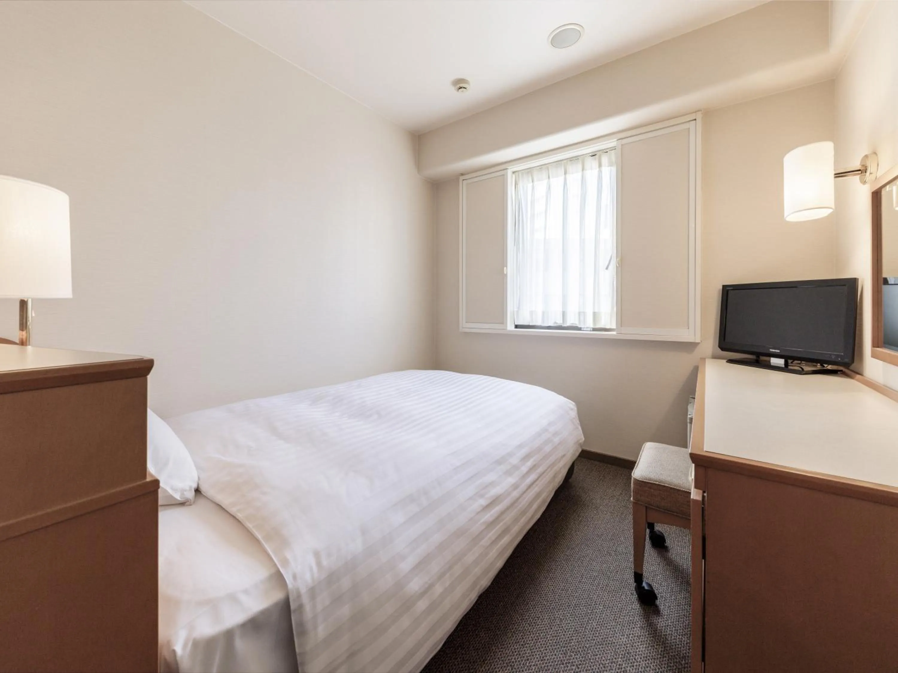 Photo of the whole room, Bed in Nishitetsu Inn Tenjin