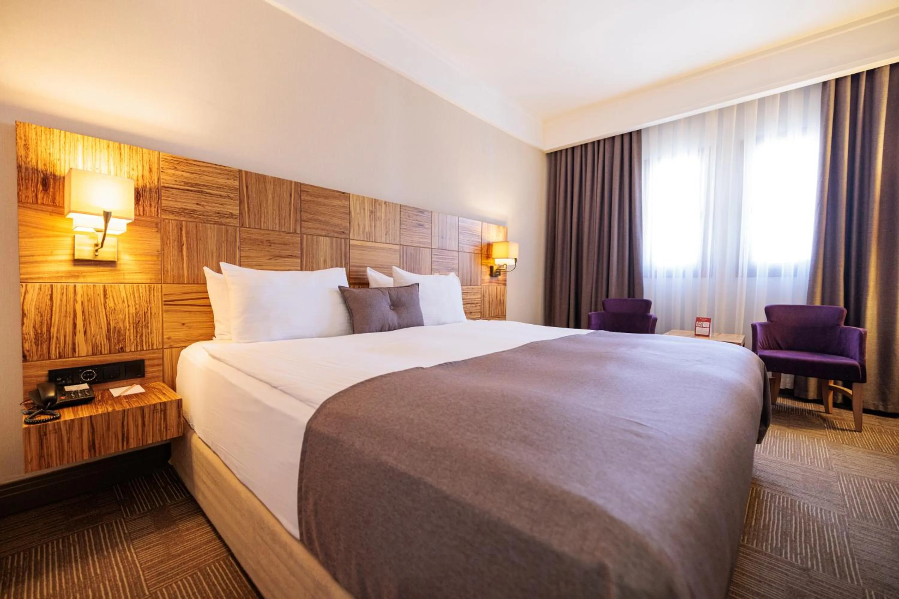 Bed in Ramada By Wyndham Cappadocia