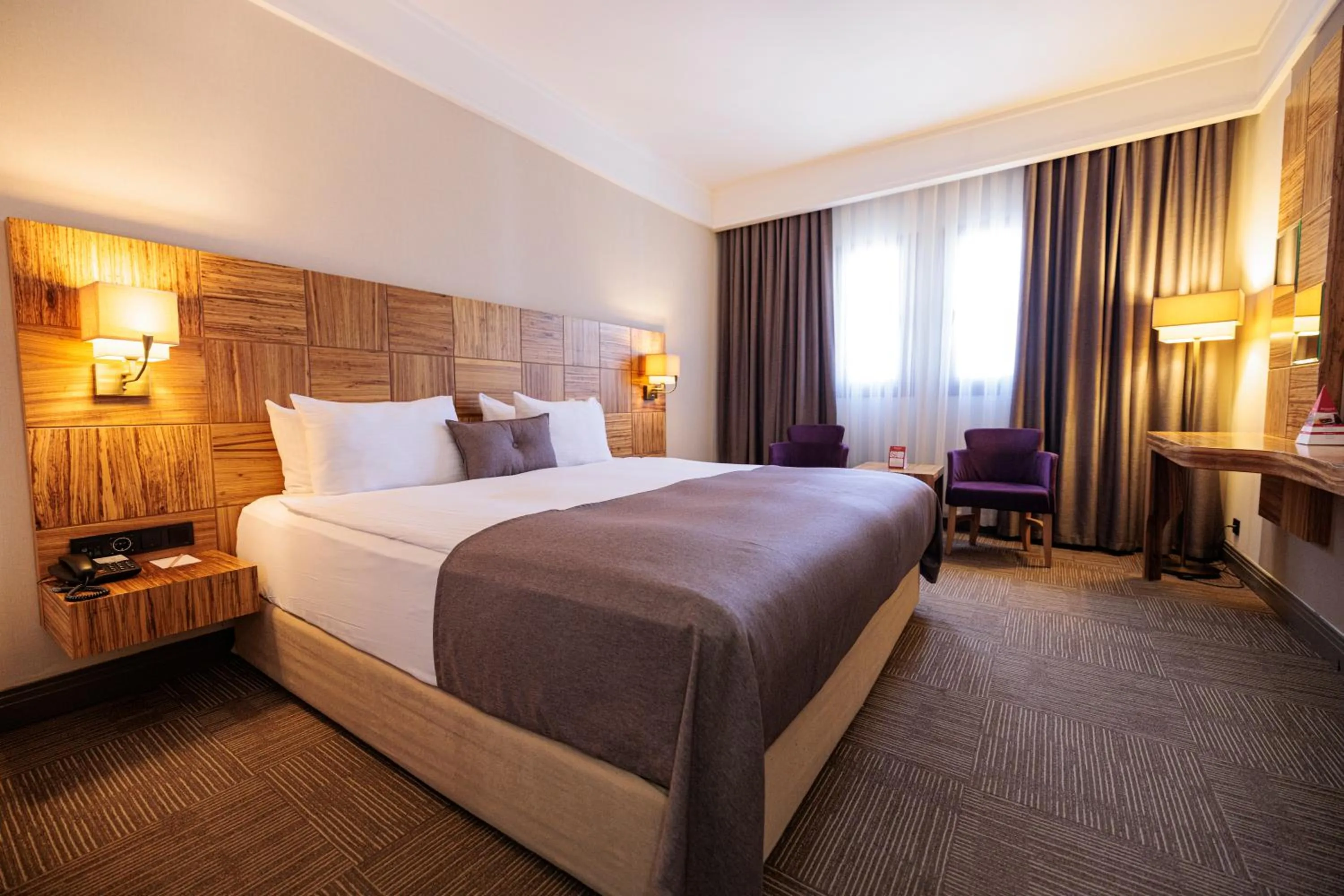 Bed in Ramada By Wyndham Cappadocia