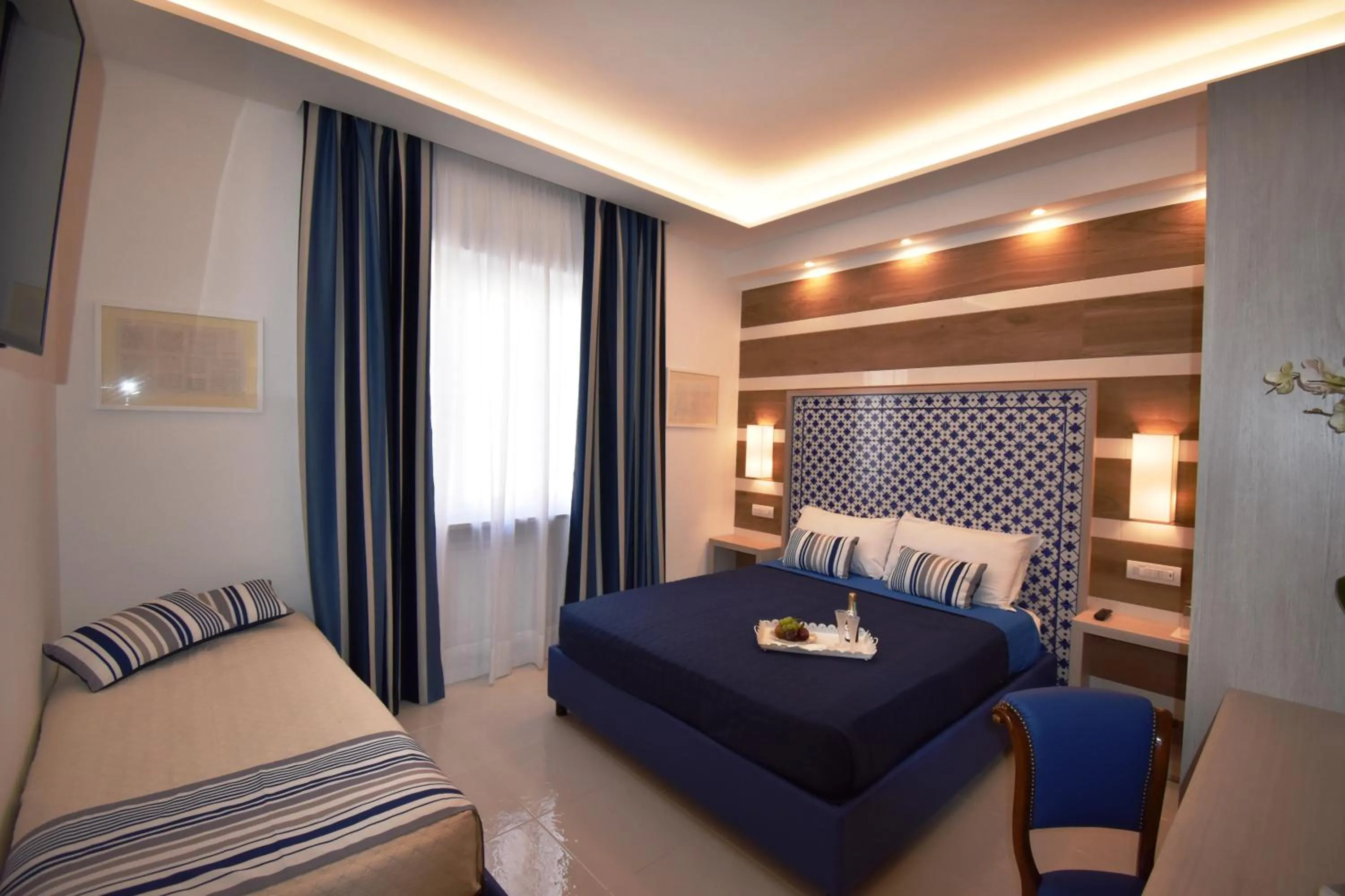 Photo of the whole room, Bed in Melody Sorrento Suites