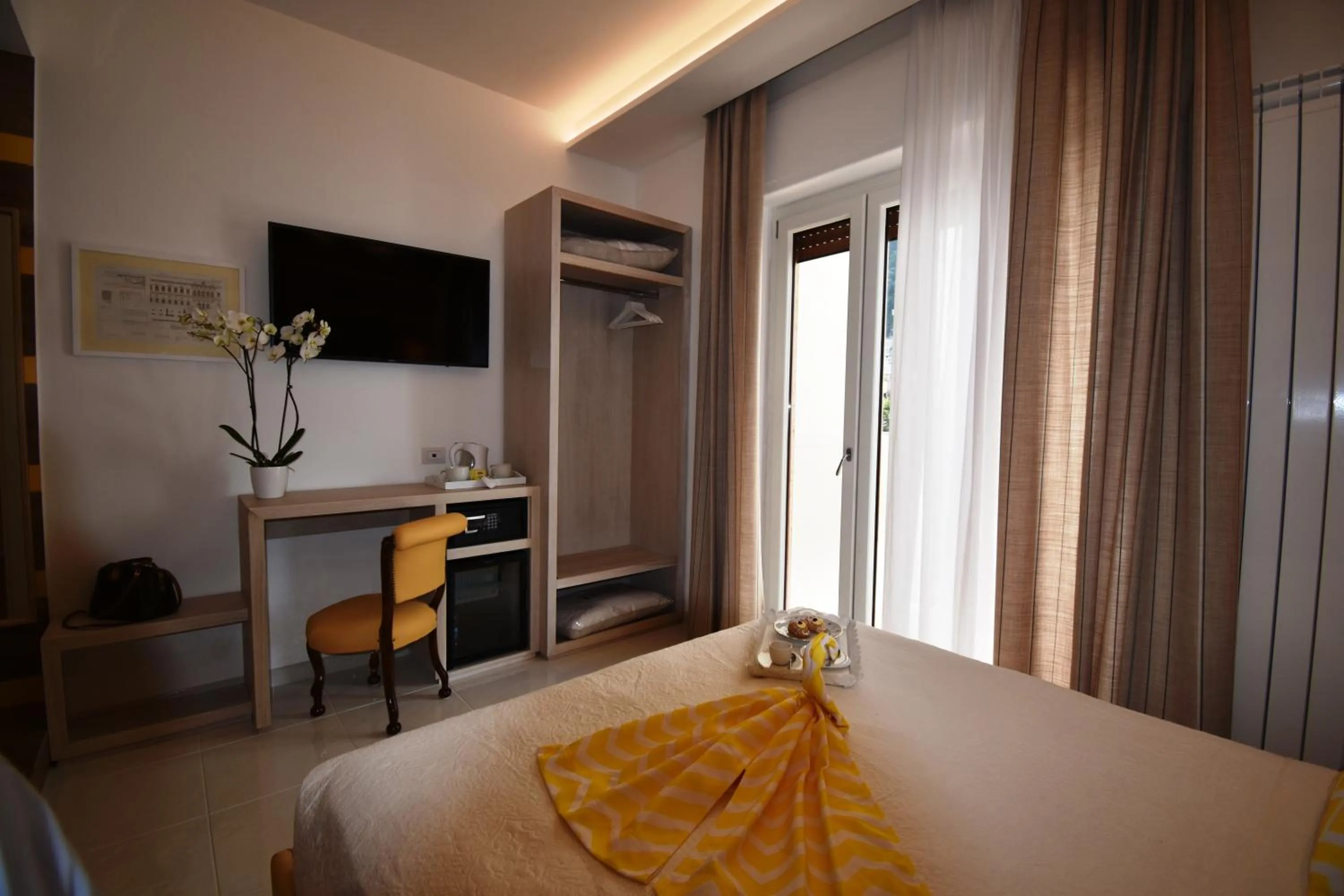 Photo of the whole room, Bed in Melody Sorrento Suites