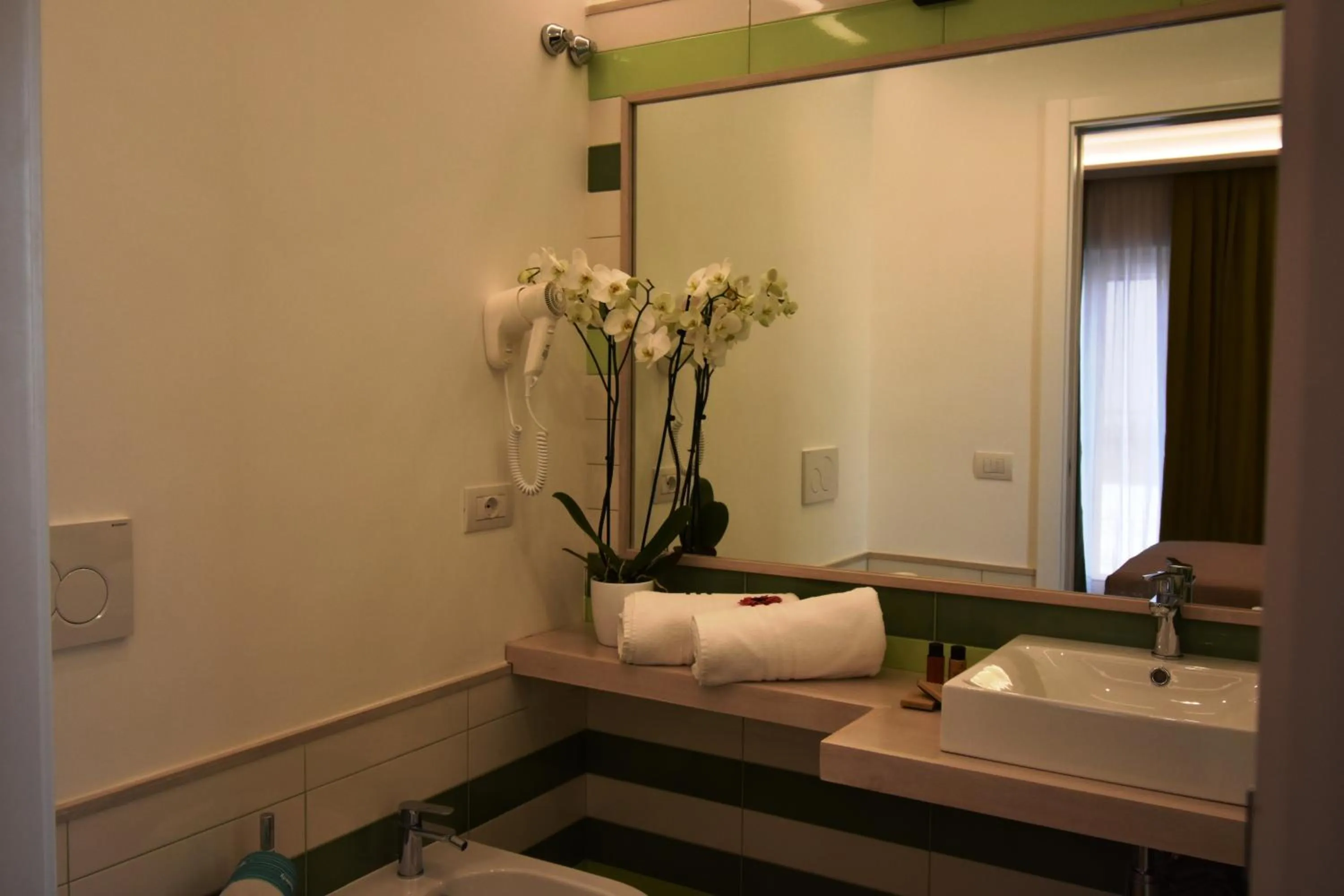 Bathroom, Bed in Melody Sorrento Suites
