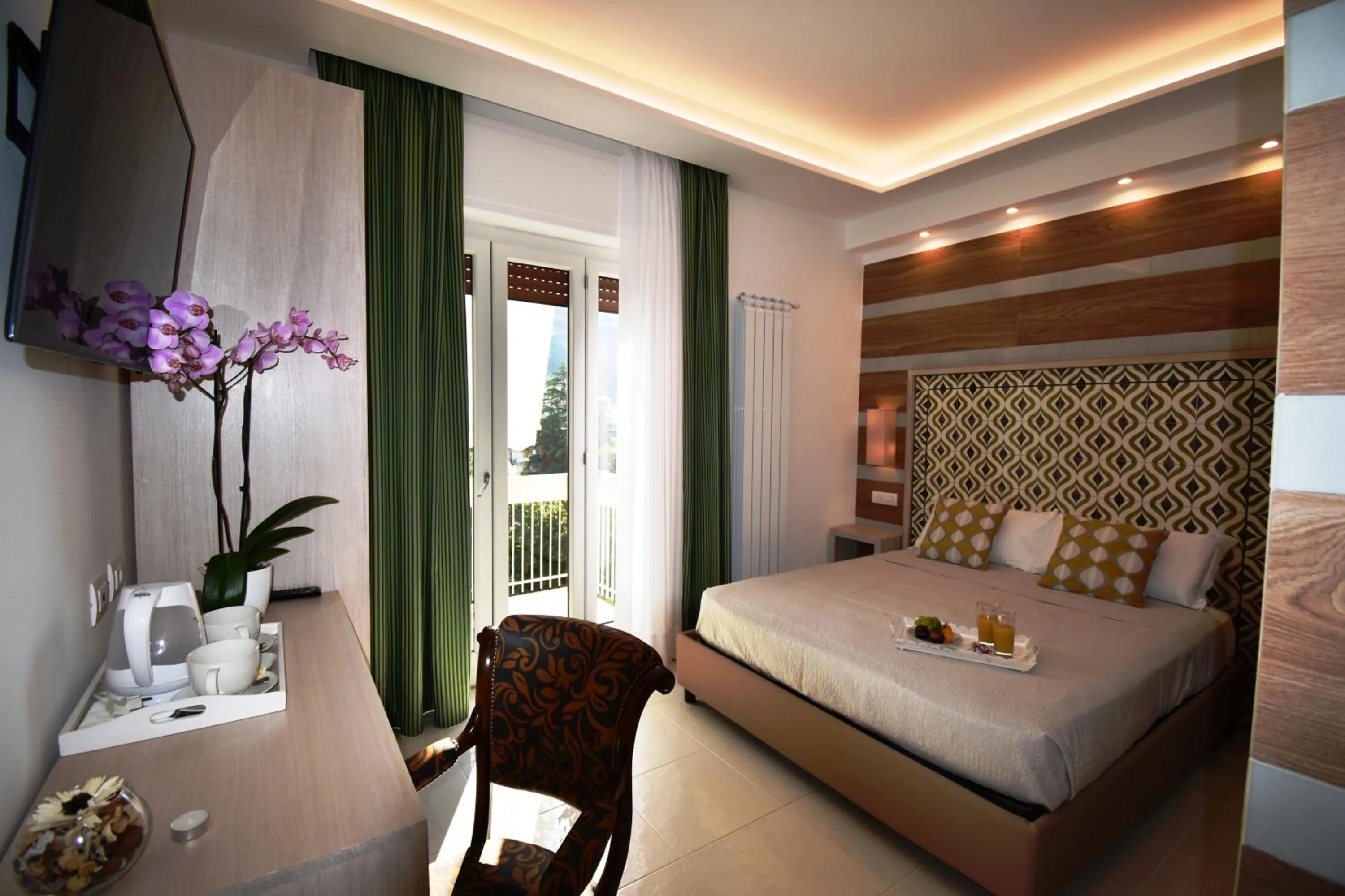 Photo of the whole room, Bed in Melody Sorrento Suites