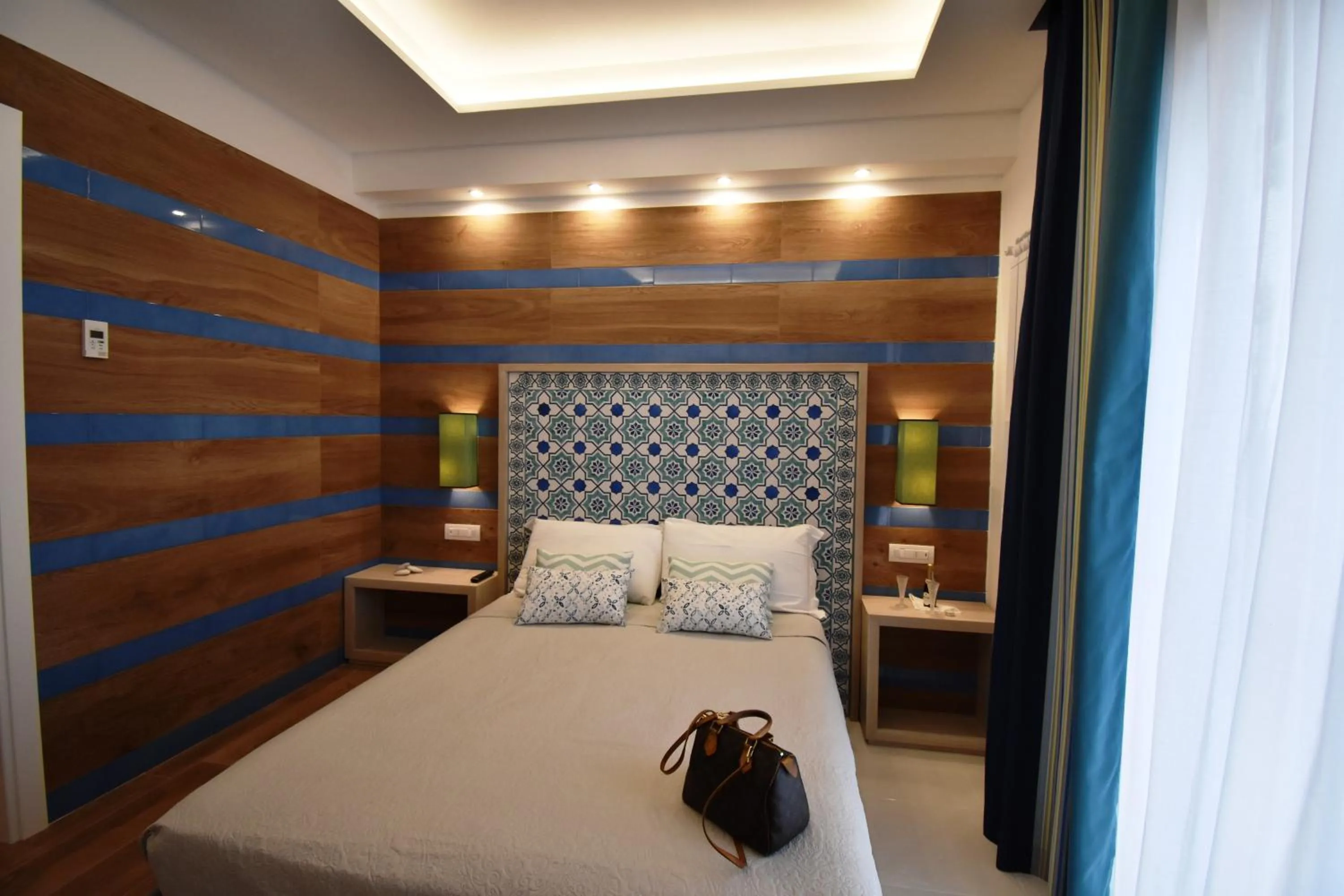 Photo of the whole room, Bed in Melody Sorrento Suites