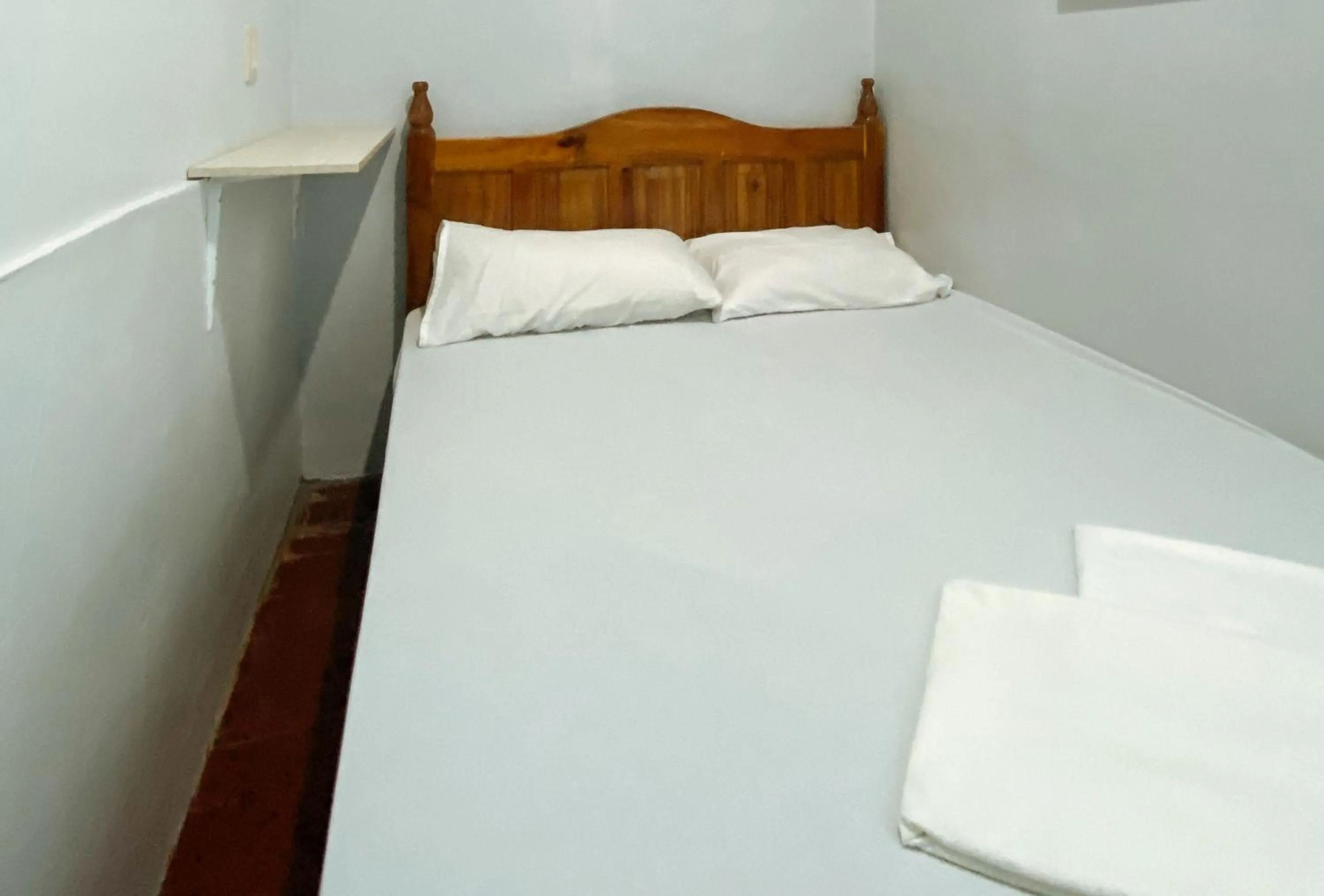 Photo of the whole room, Bed in UrbanView BNKY Bed and Breakfast Palawan by RedDoorz