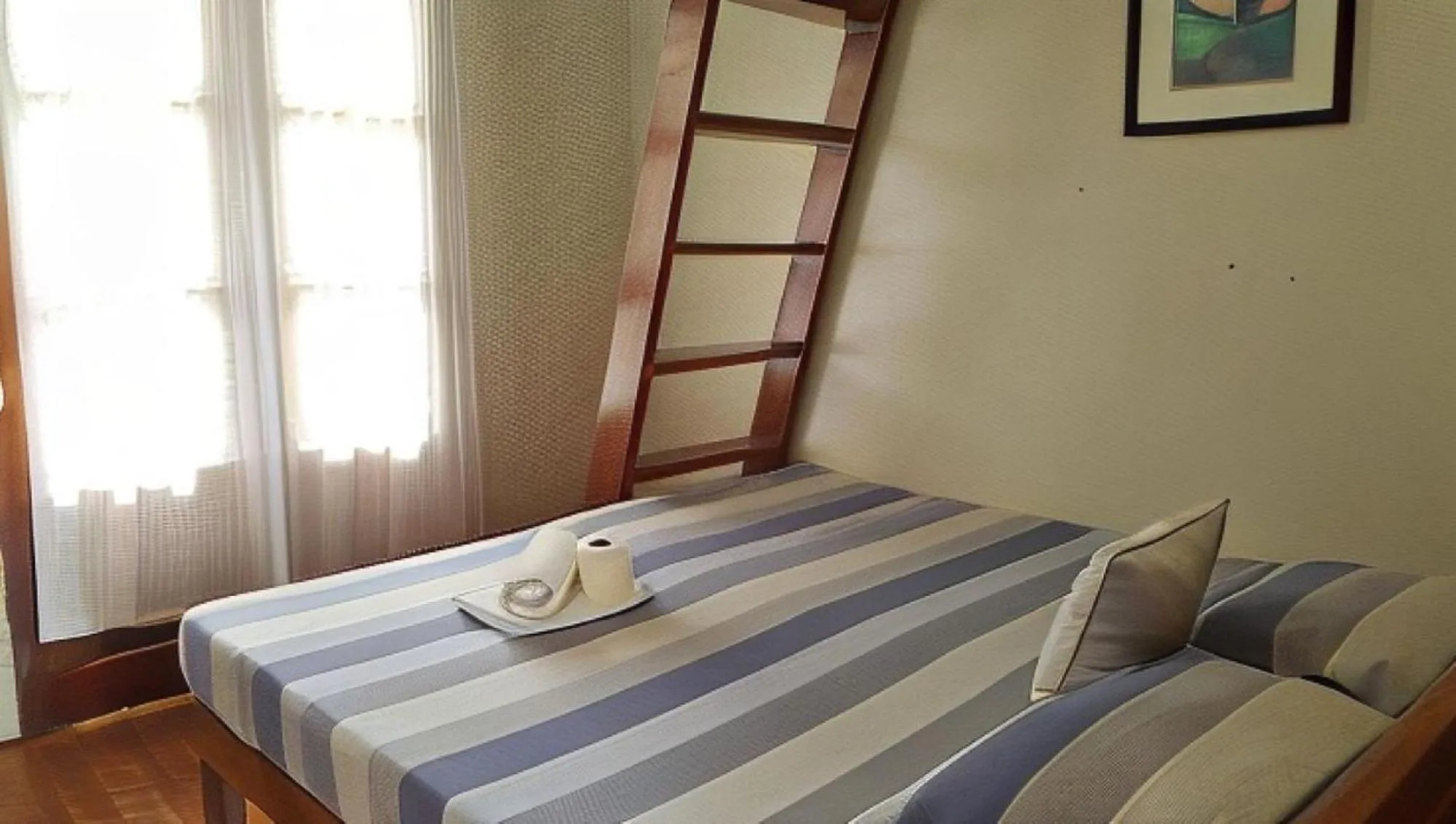 Bed in UrbanView BNKY Bed and Breakfast Palawan by RedDoorz