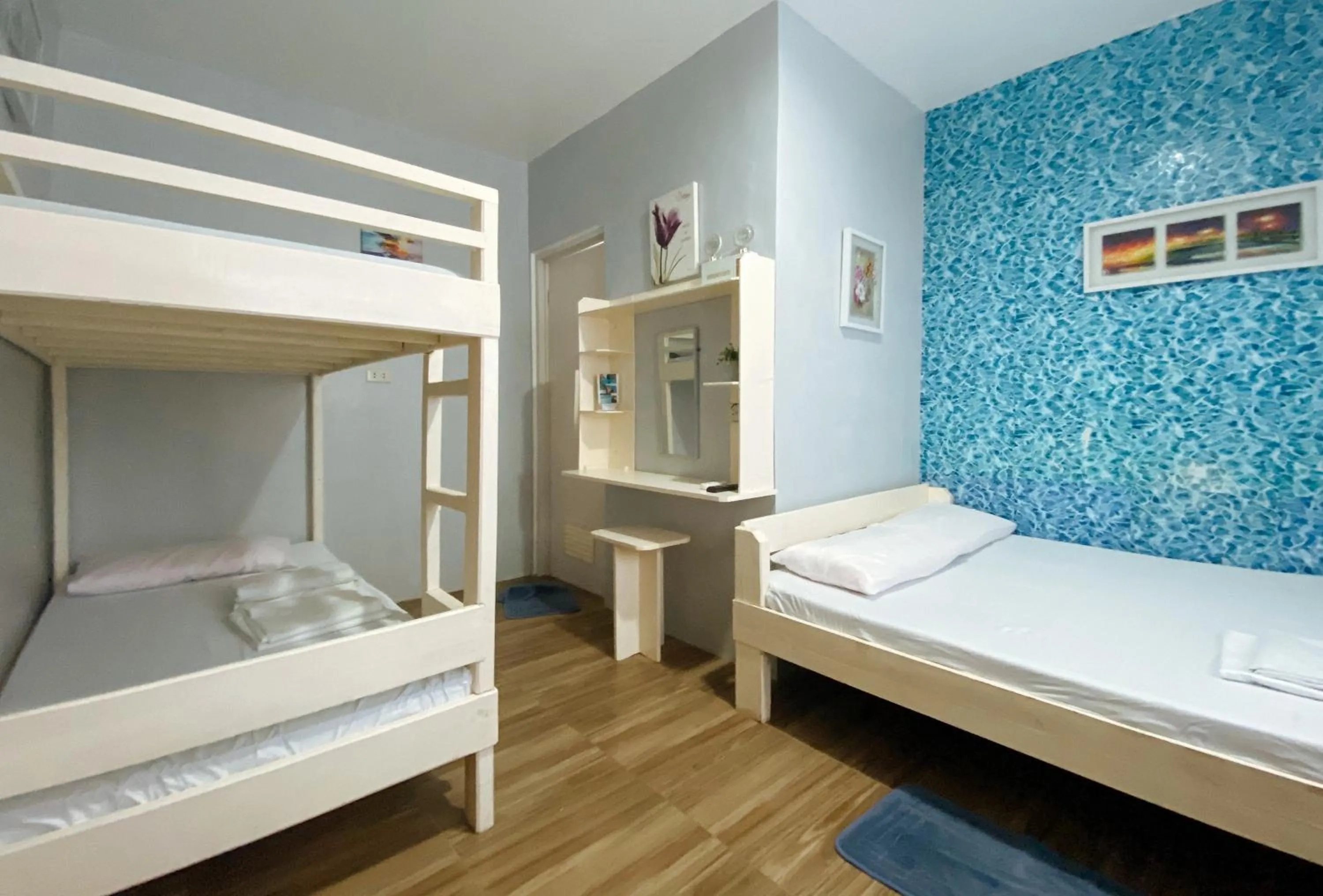 Photo of the whole room, Bed in UrbanView BNKY Bed and Breakfast Palawan by RedDoorz