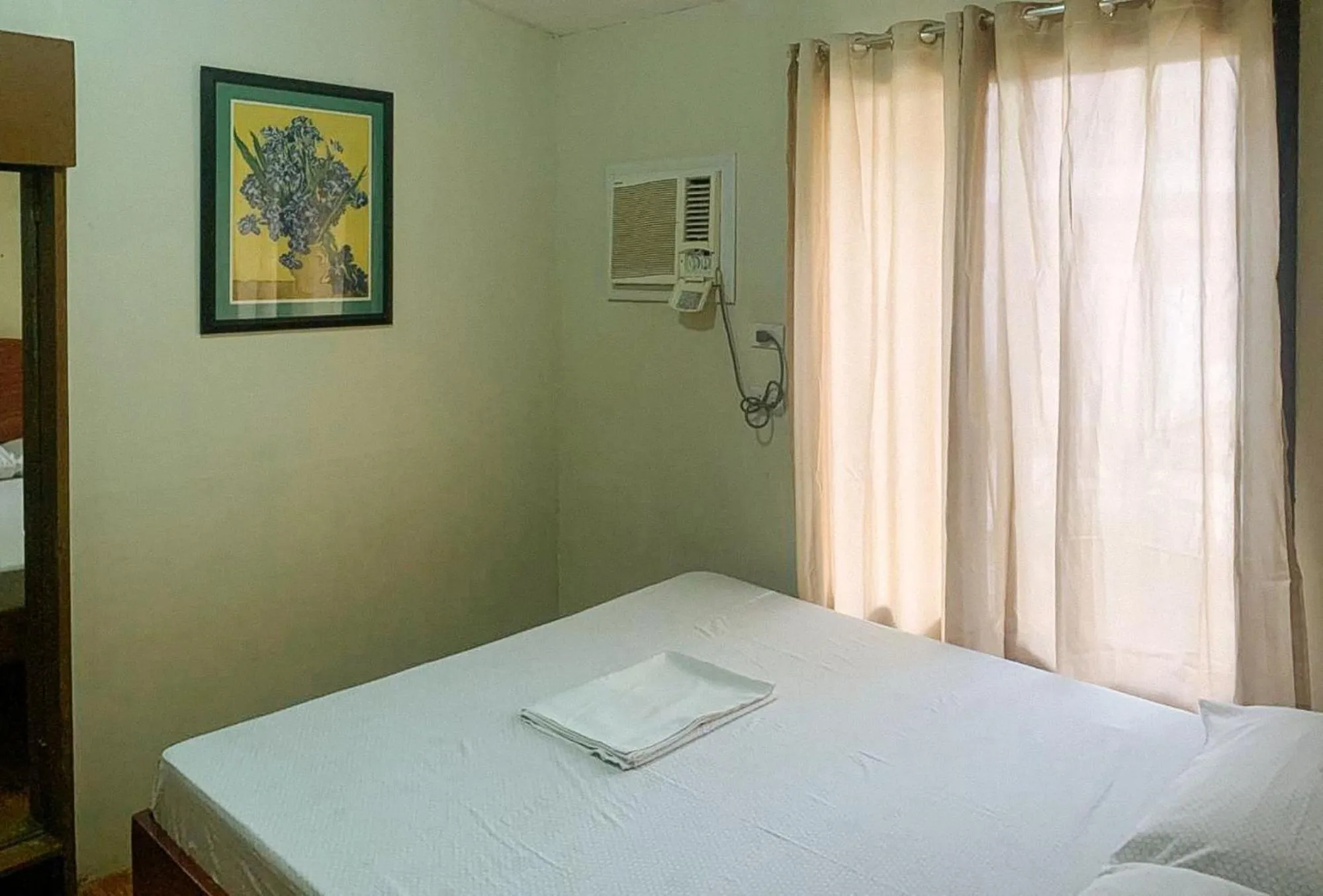 Bed in UrbanView BNKY Bed and Breakfast Palawan by RedDoorz