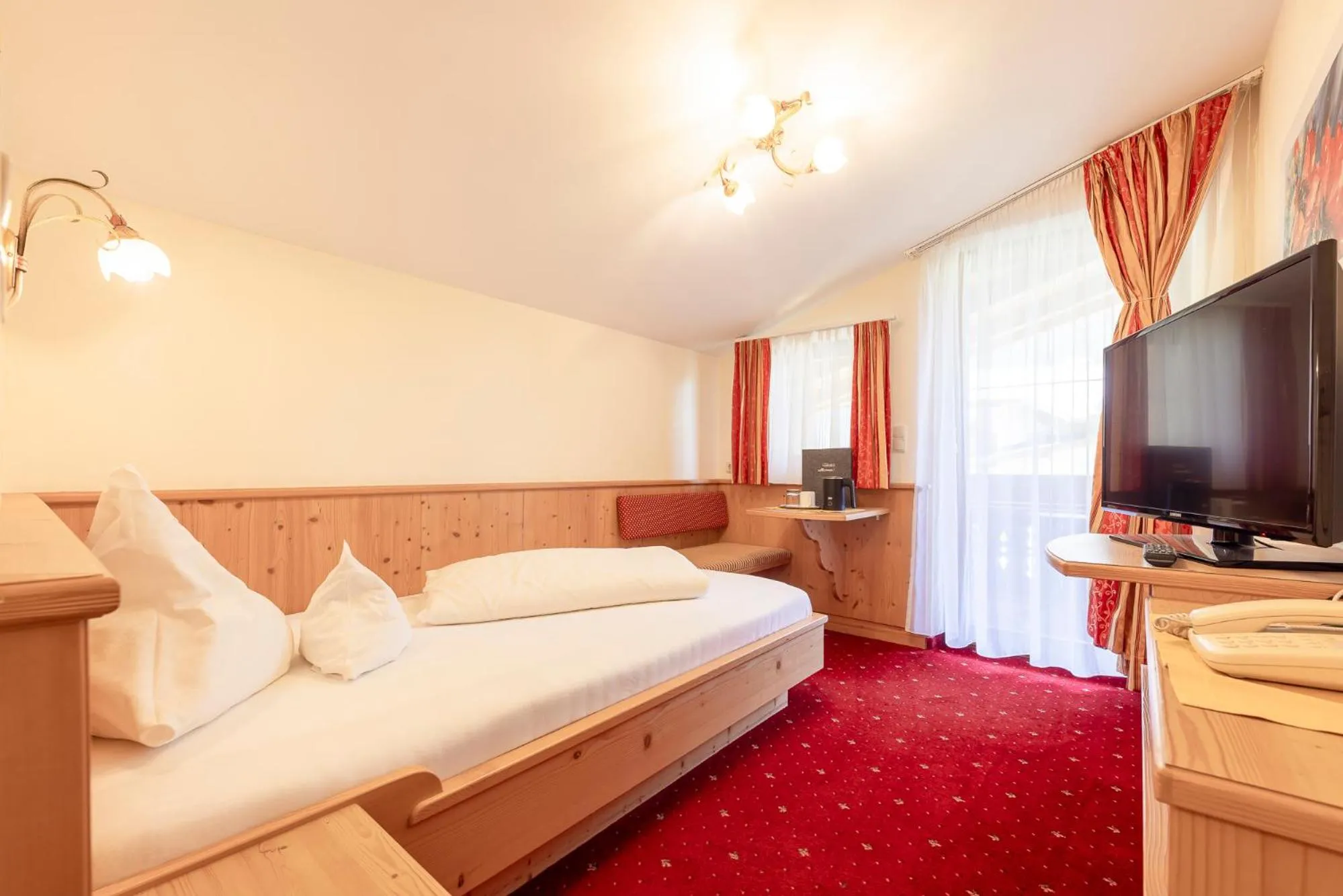 Bed in Alpenpension Pfurtscheller
