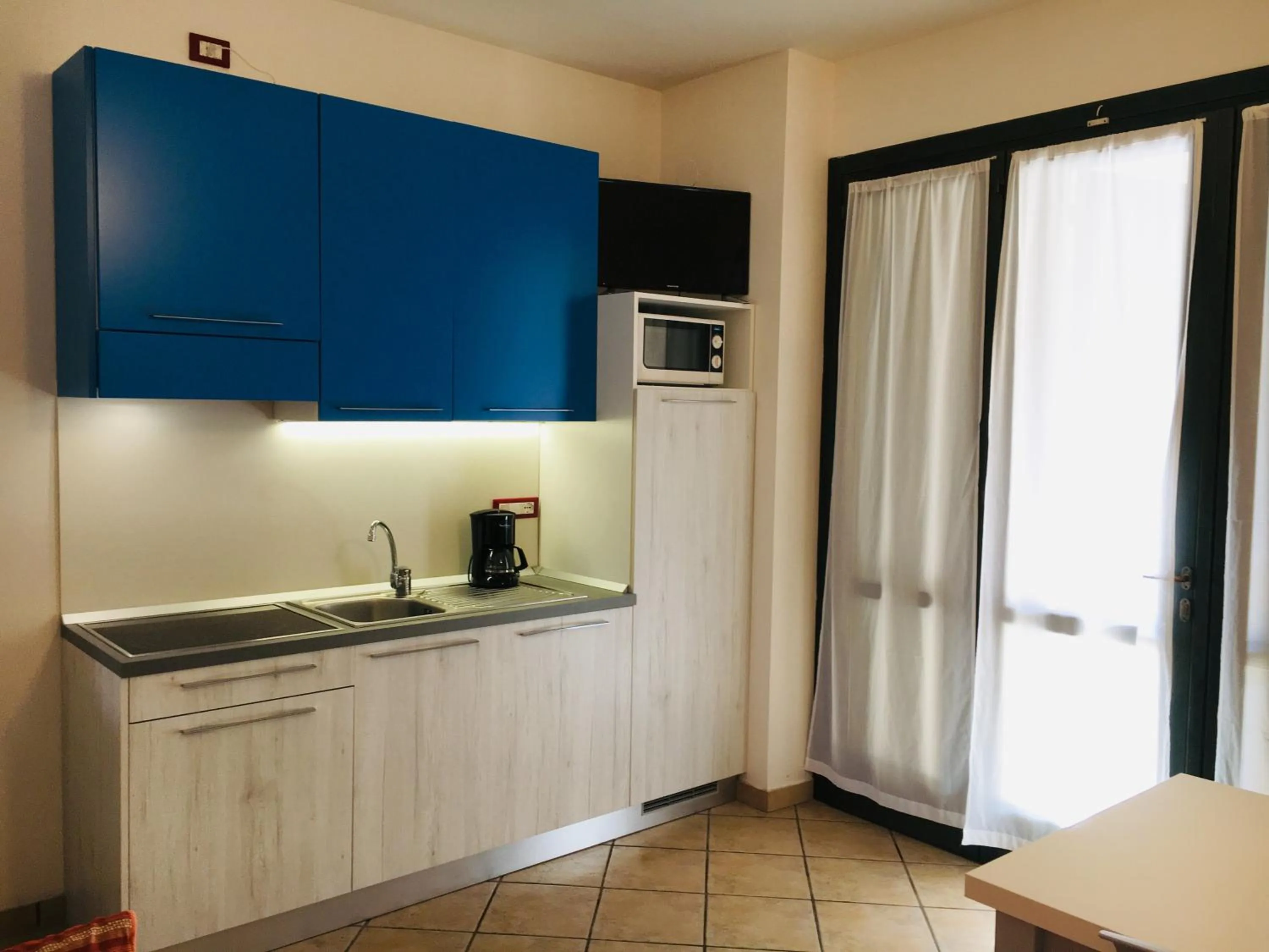 Kitchen or kitchenette in Michelangelo Holiday & Family Resort