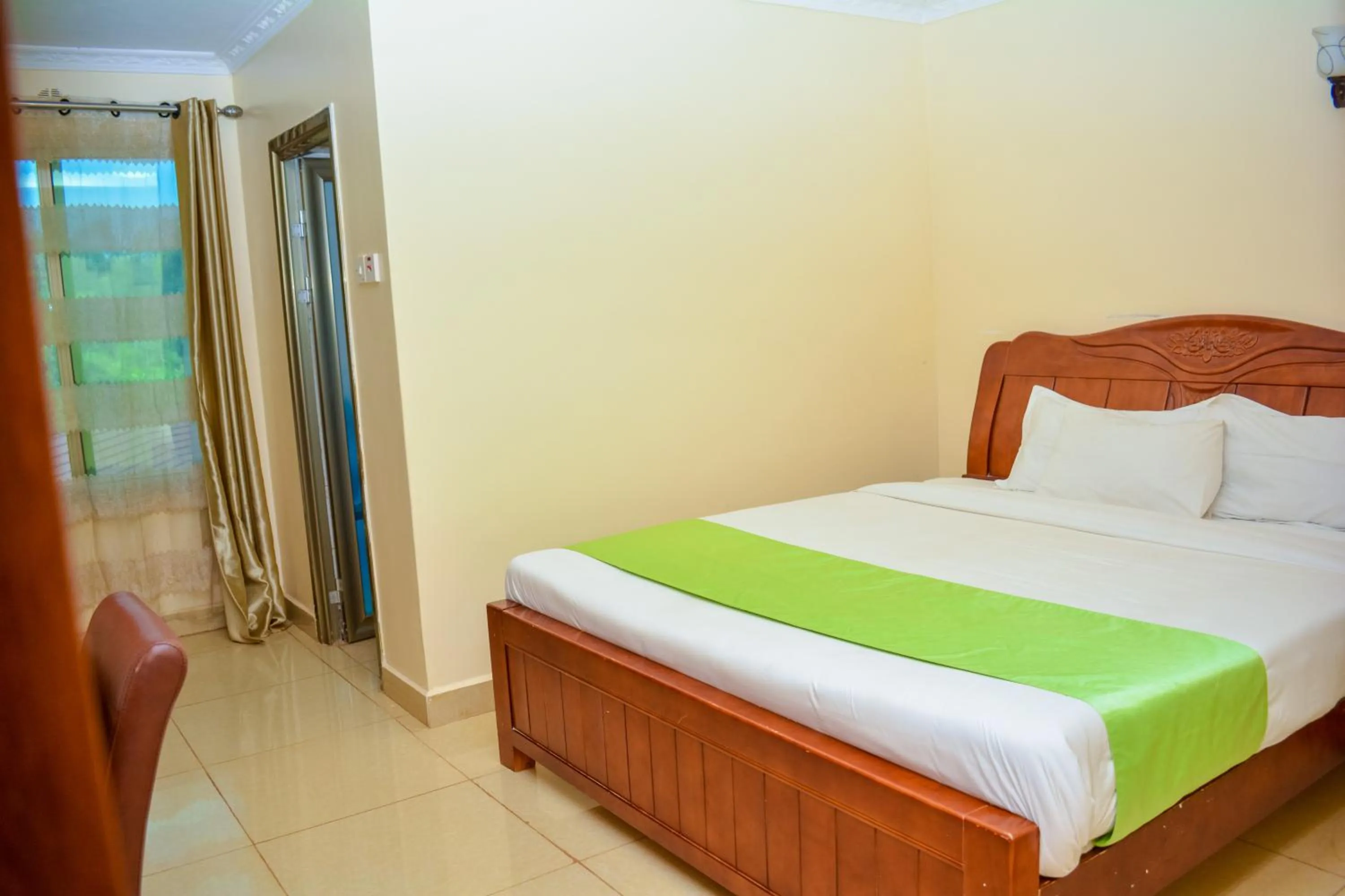 Bedroom in Omega Gardens Hotel