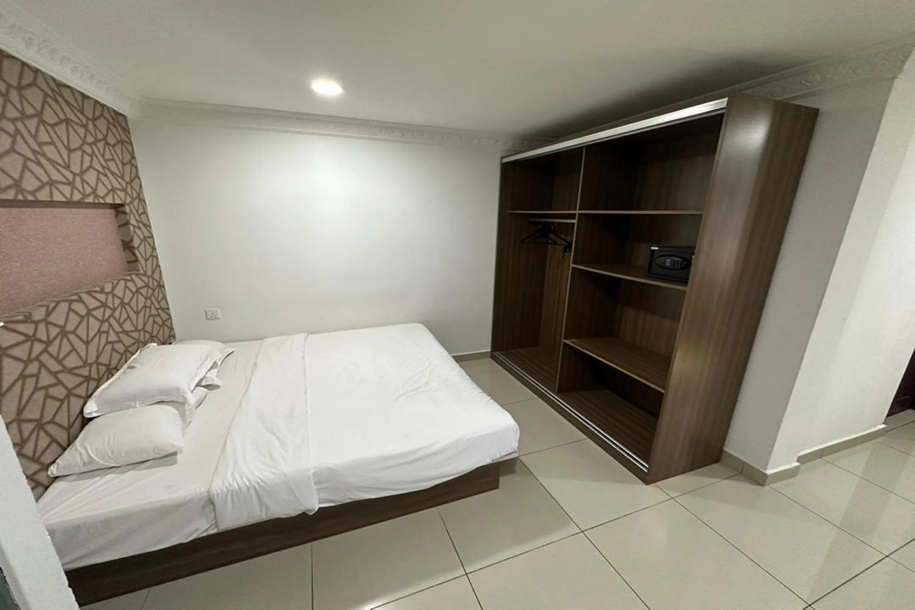 Bedroom, Bed in Poorna Hotel