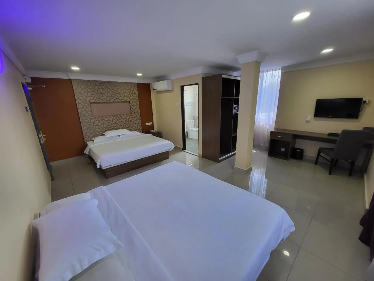 Bed in Poorna Hotel