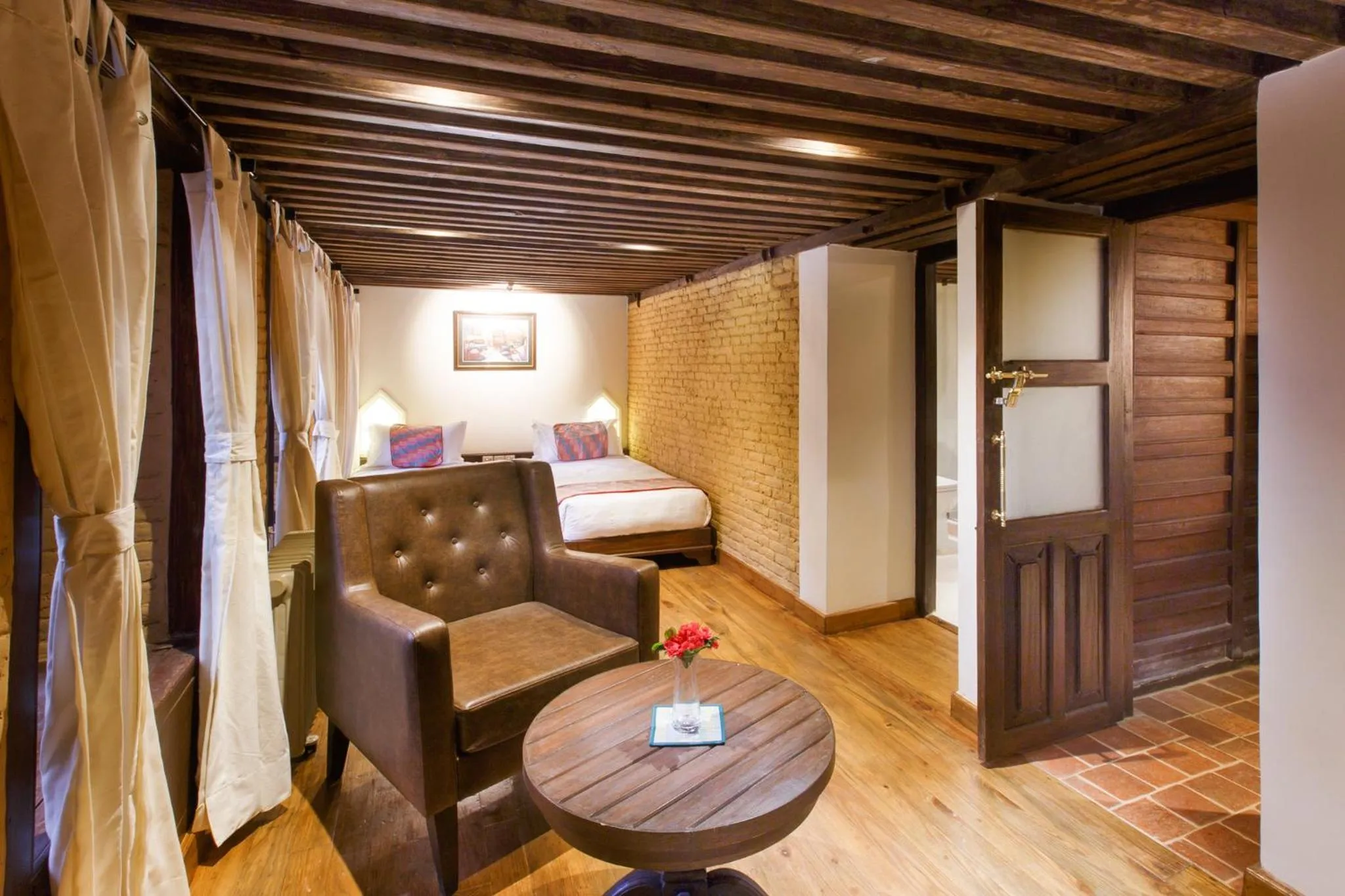 Seating area, Bed in Hotel Patan House