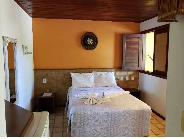 Bed in Pousada Bichelenga