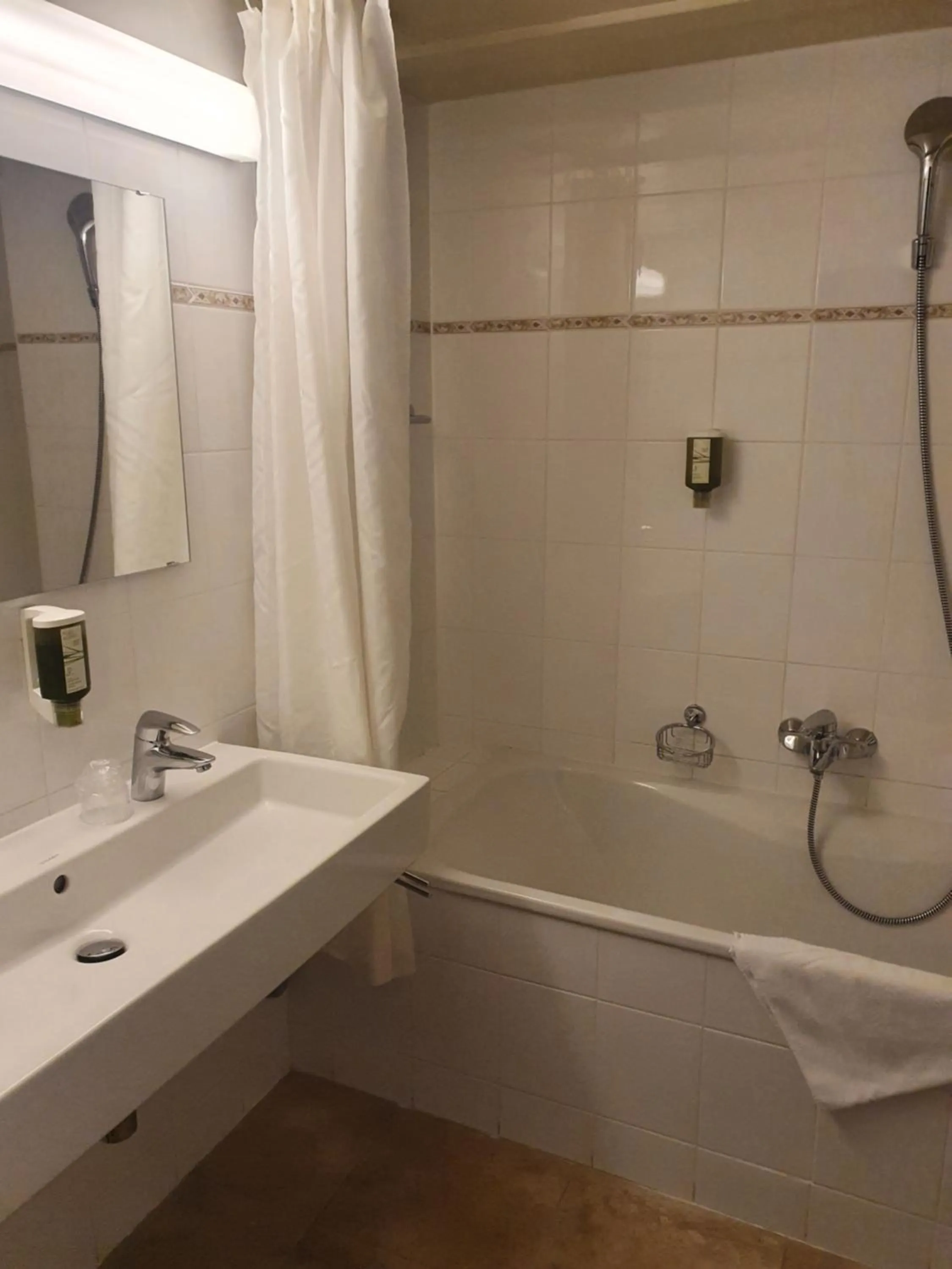 Bathroom in L'Hôtel by Hostellerie du Château