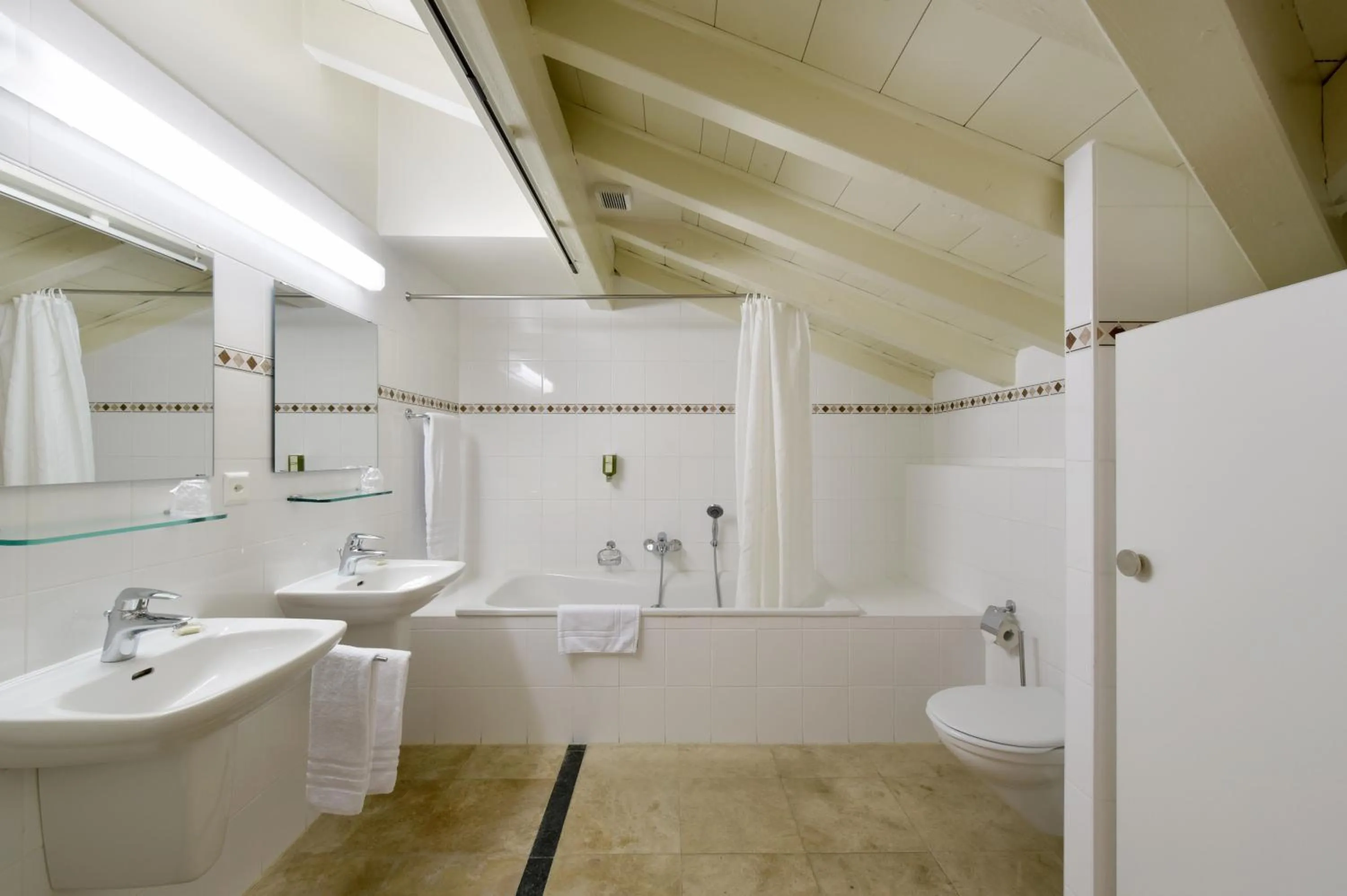 Bathroom in L'Hôtel by Hostellerie du Château