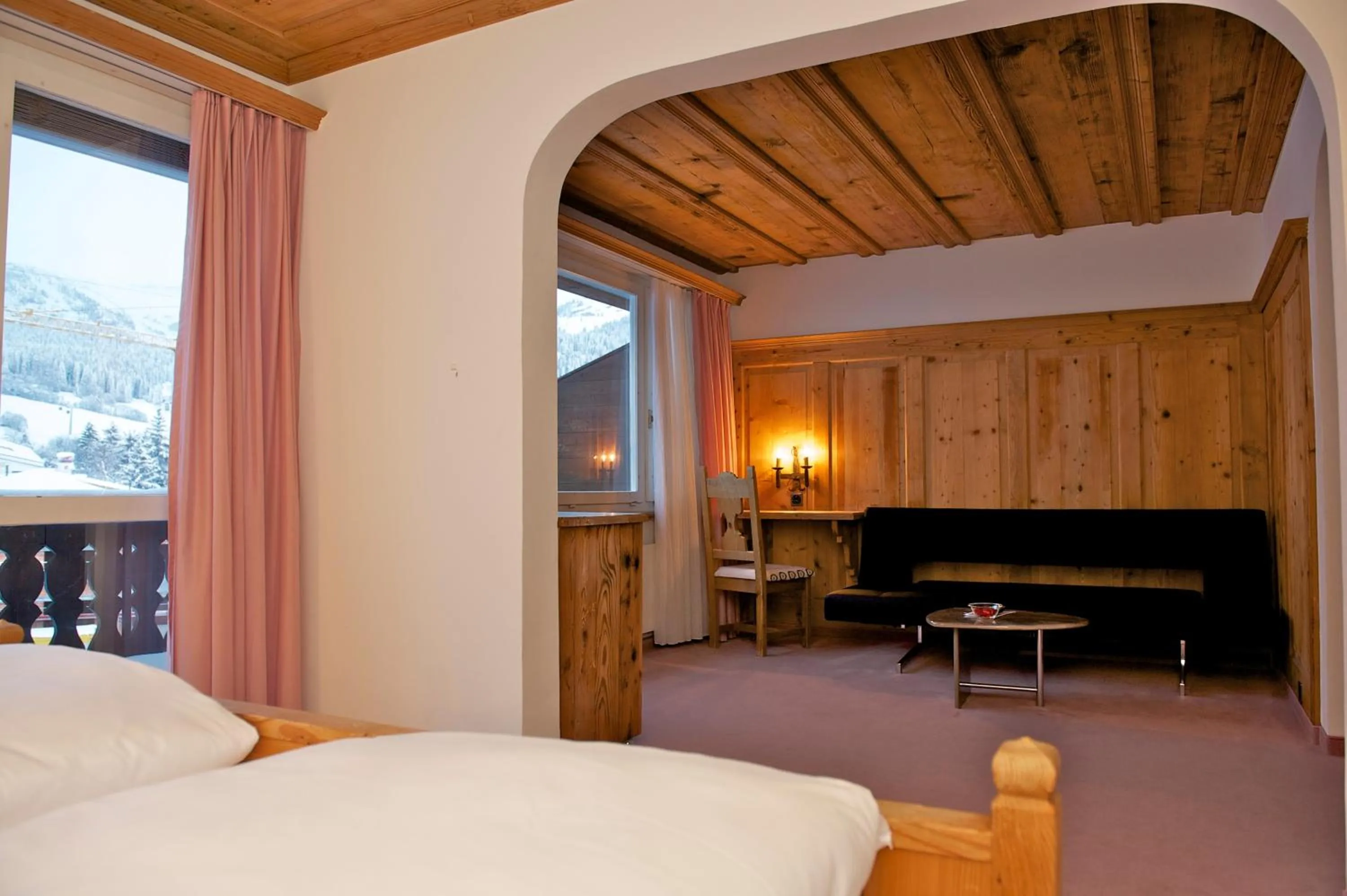 Seating area, Bed in Hotel Restaurant Chesa