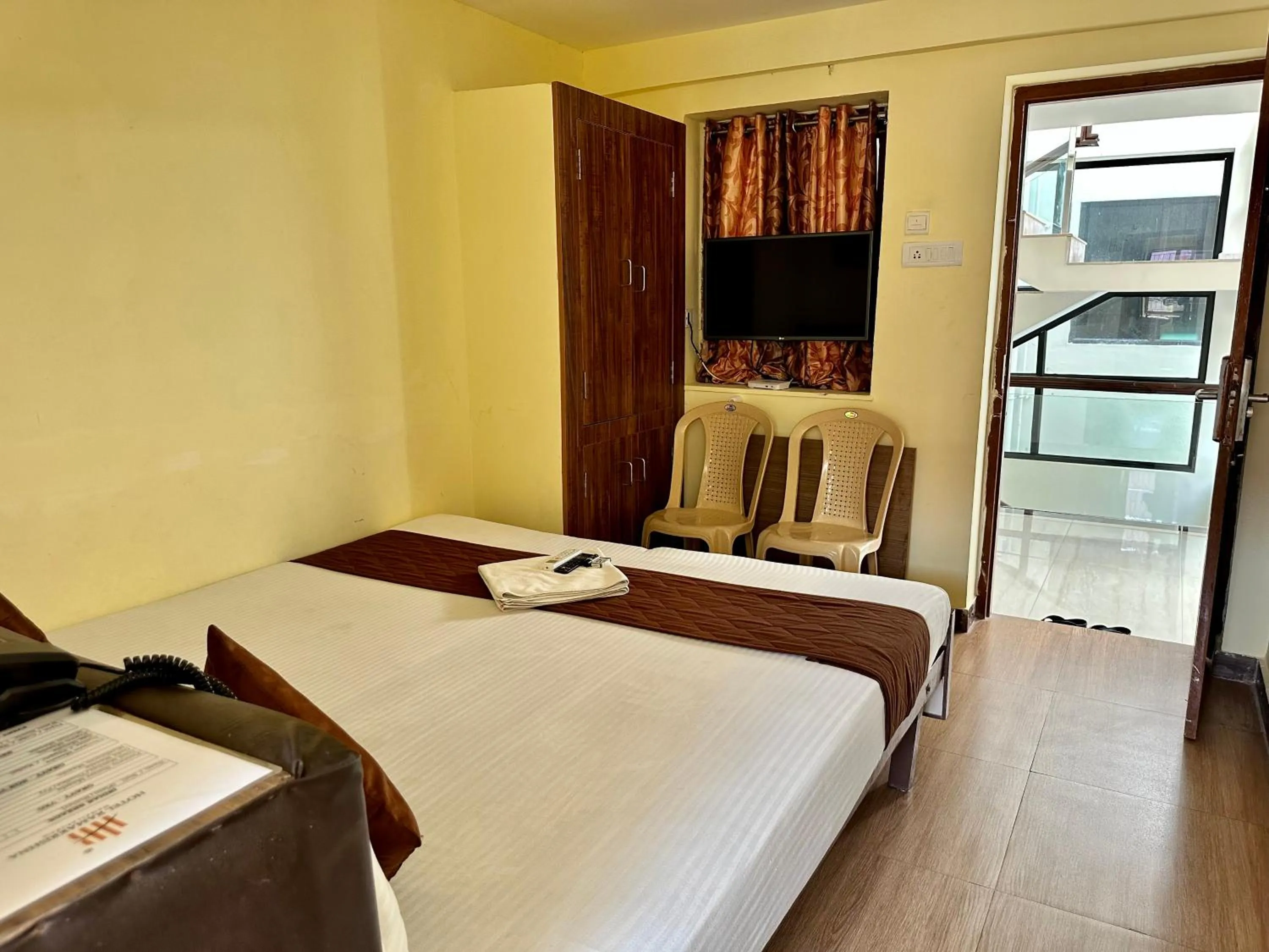 Photo of the whole room, Bed in Hotel Ramakrishna