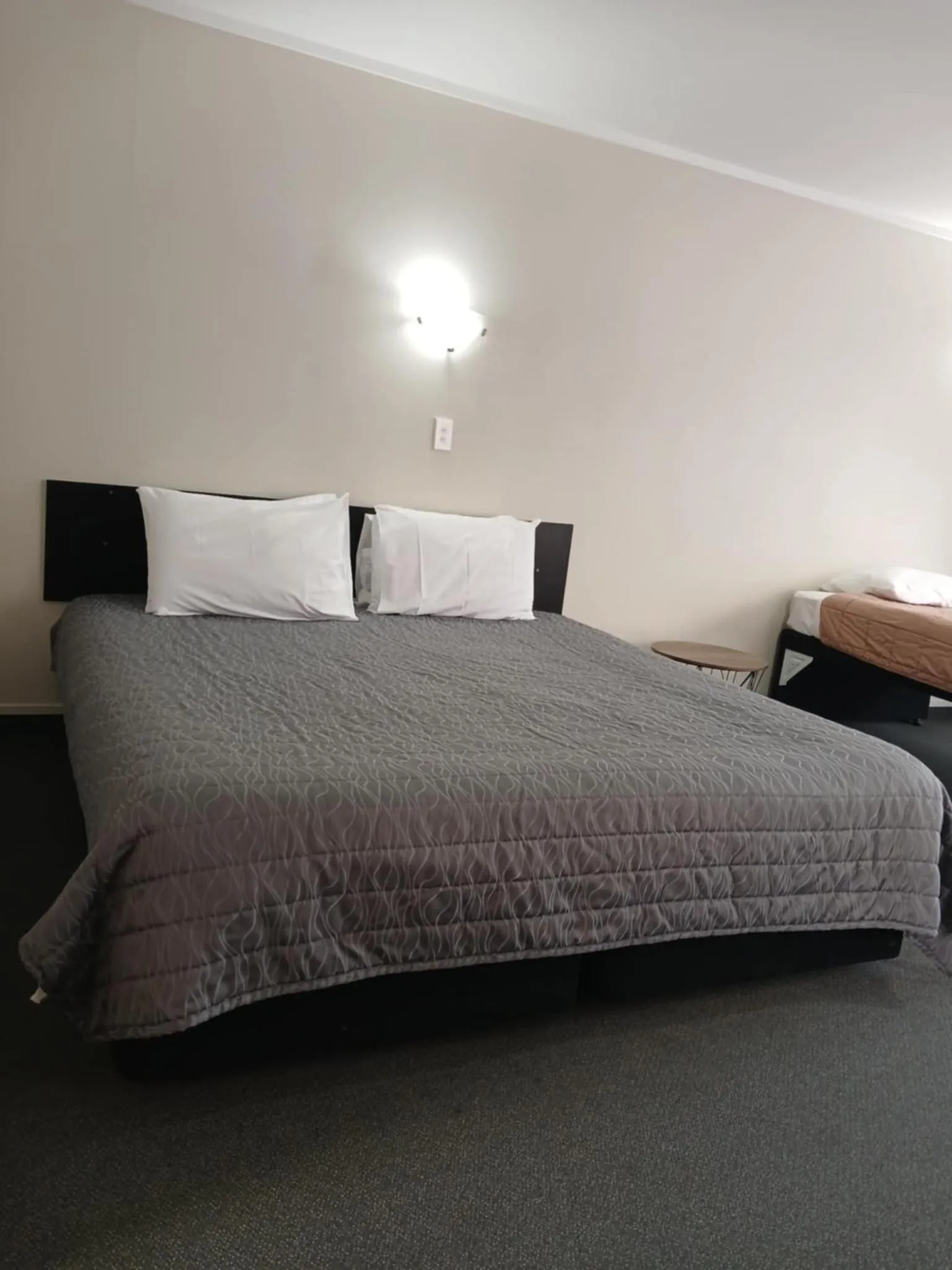 Bed in Ambassador Motel