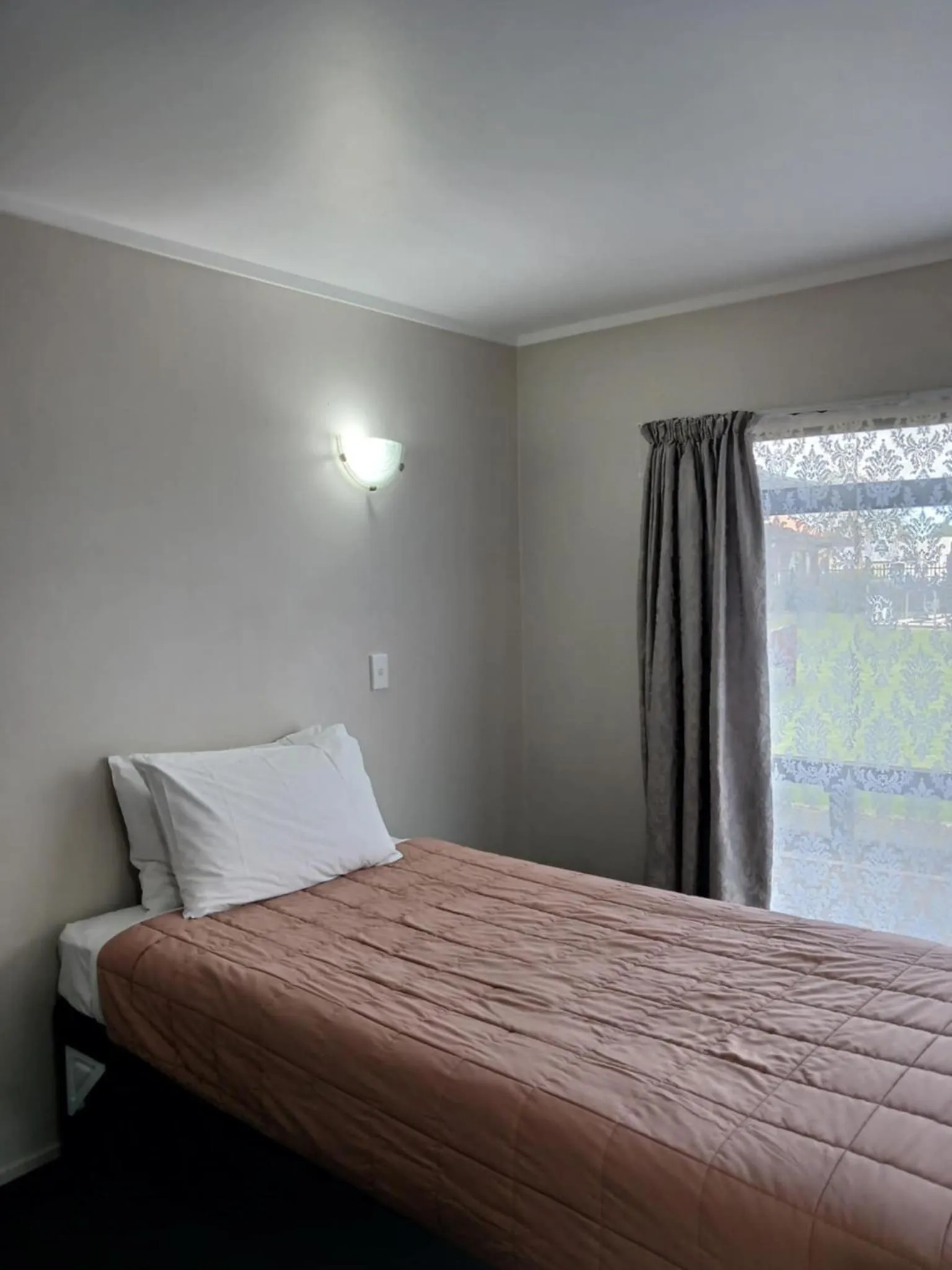 Bed in Ambassador Motel