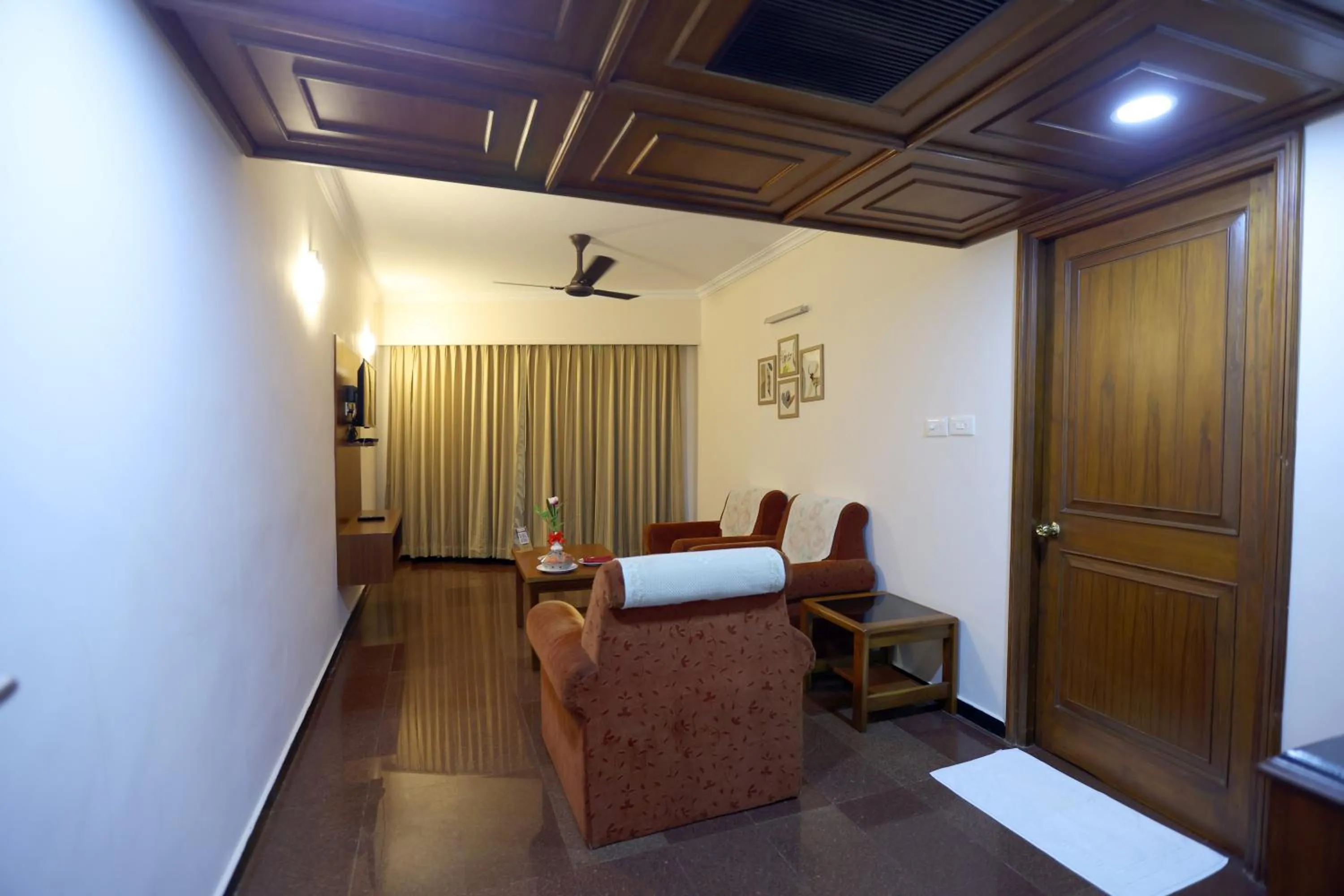 Seating area, Bed in Breeze Residency