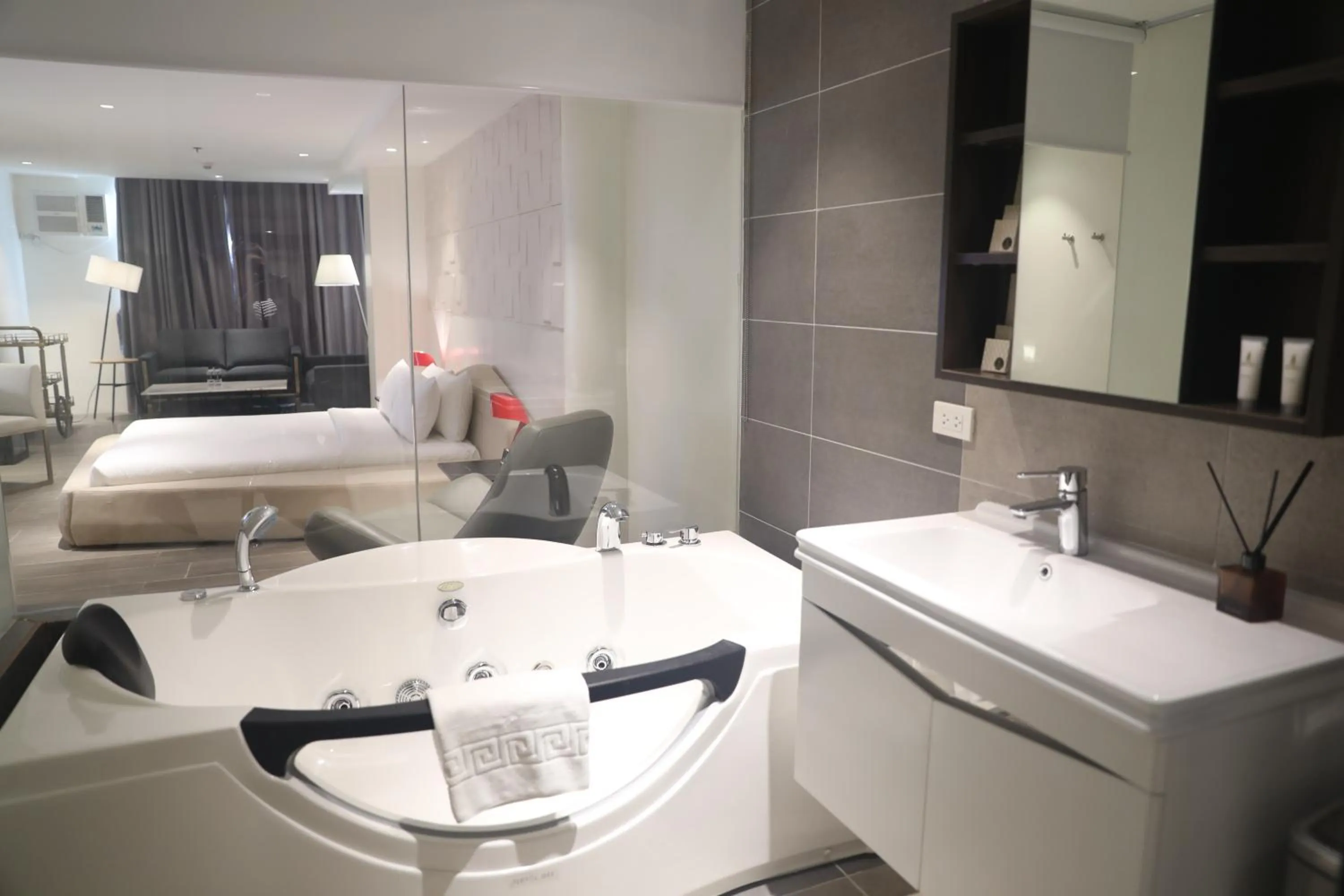 Bed in City Park Hotel Residences