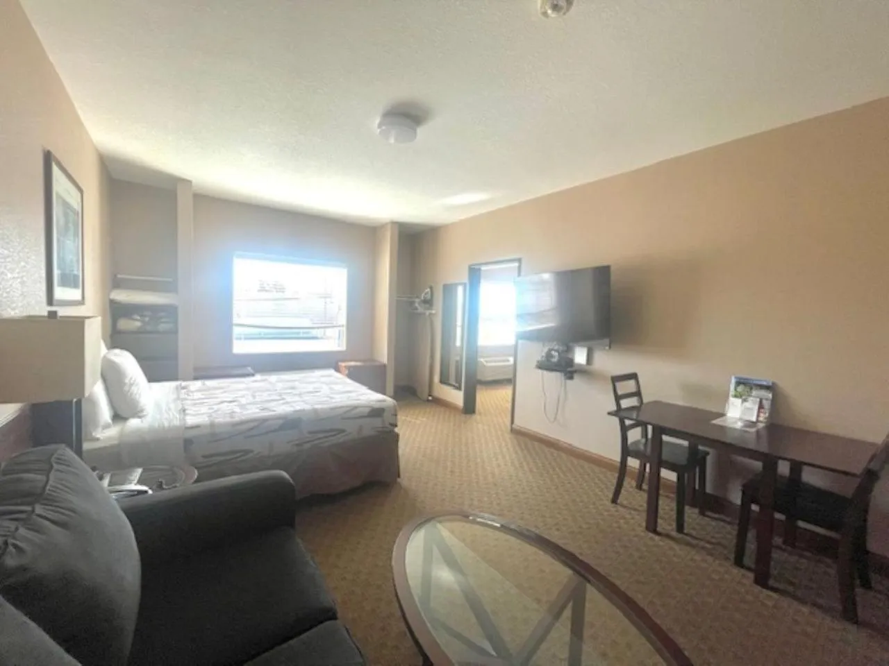 Family, Bed in Bell's Extended Stay and Suites