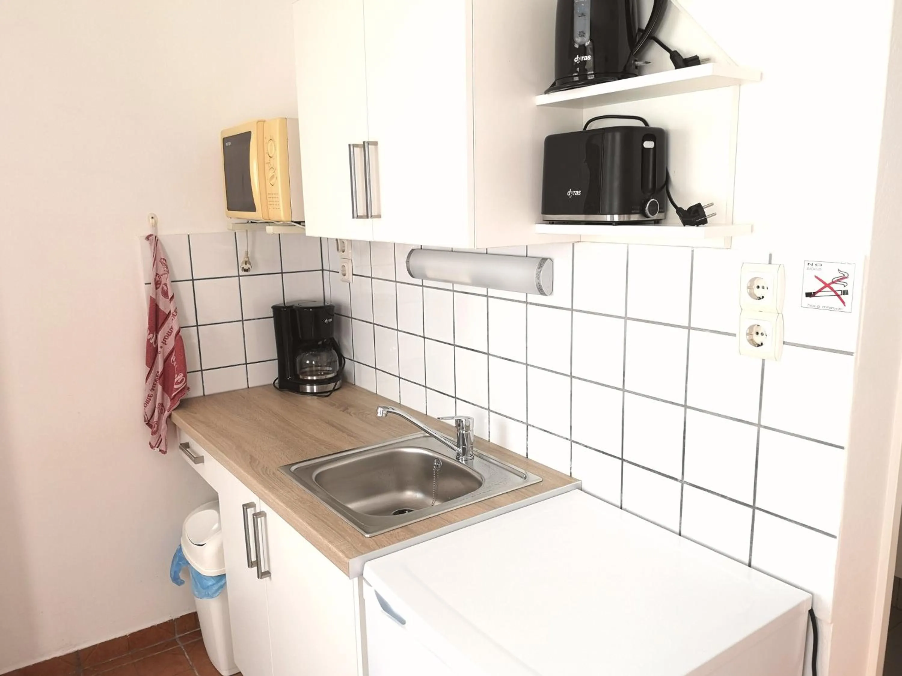 Kitchen or kitchenette in Apartman Kaszás Garden