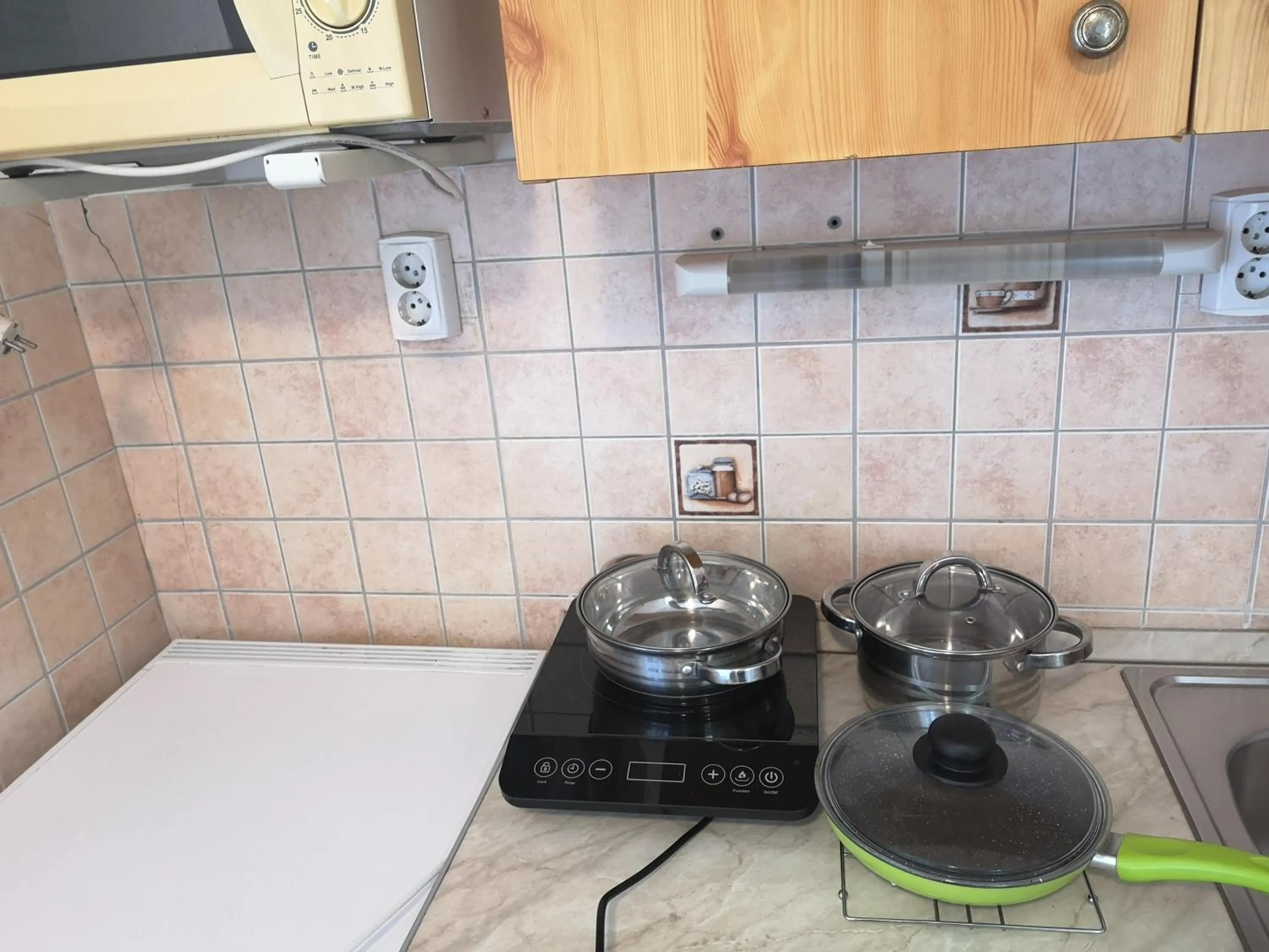 Kitchen or kitchenette in Apartman Kaszás Garden