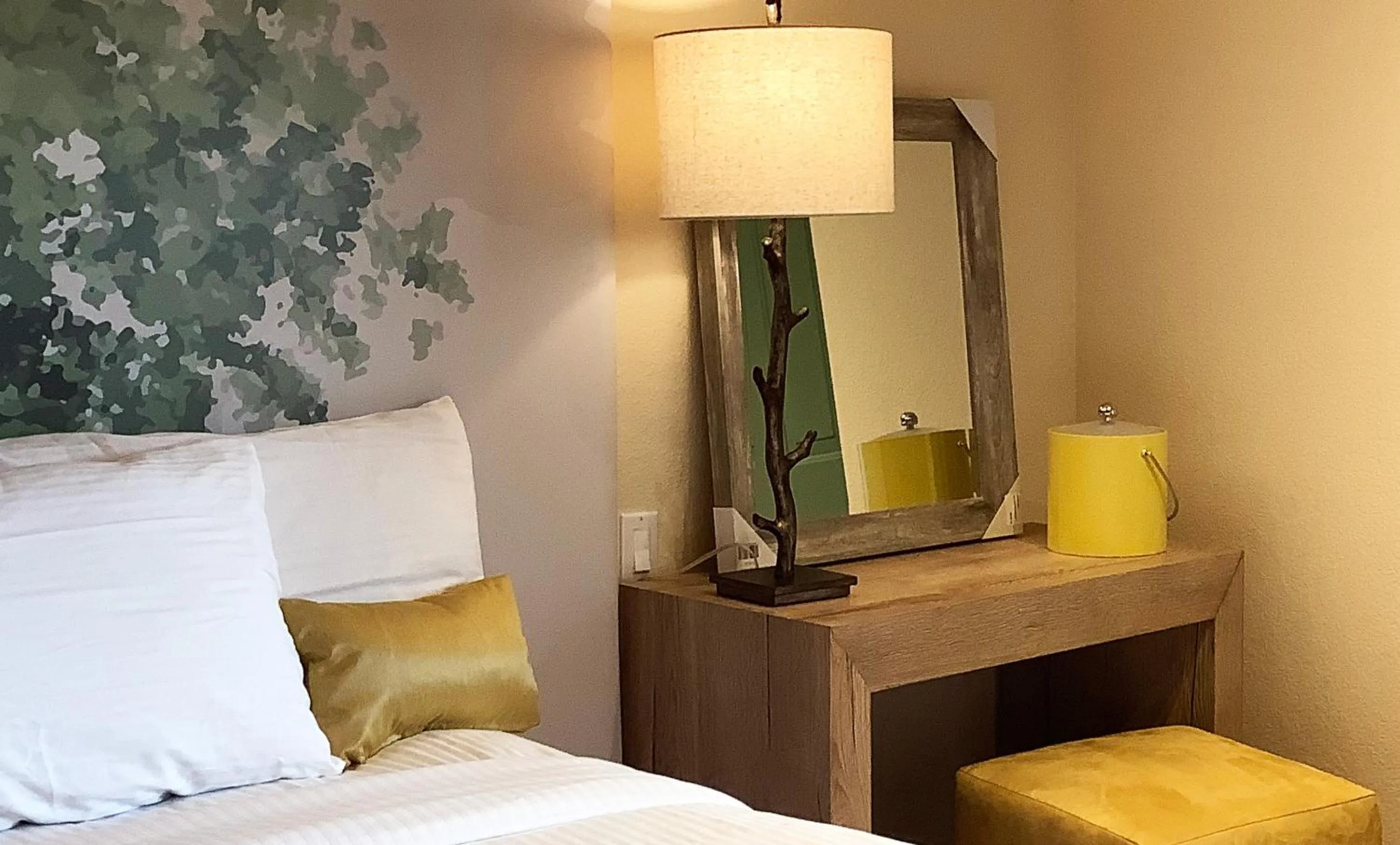 Bed in Arbors at Island Landing Hotel & Suites