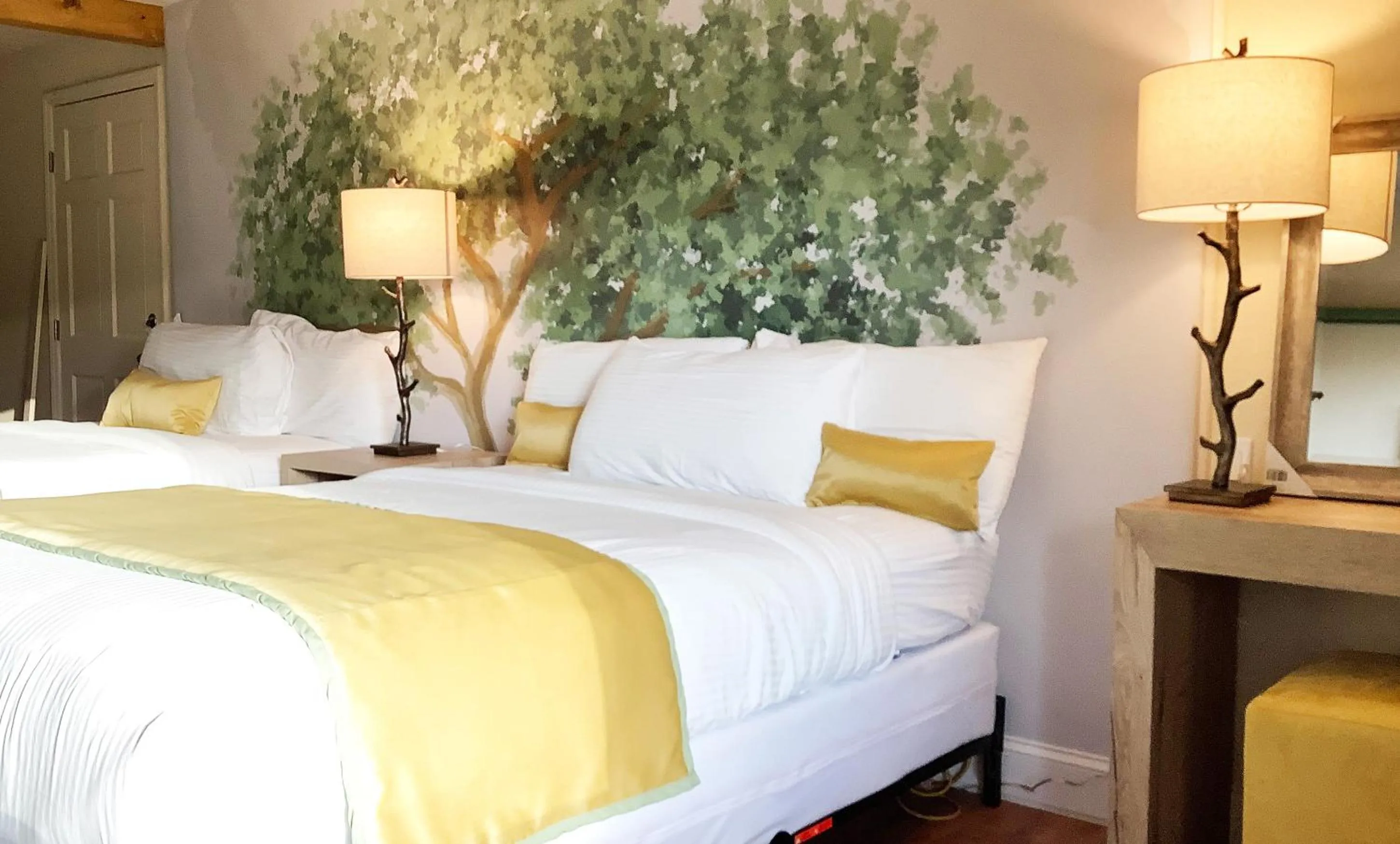 Bed in Arbors at Island Landing Hotel & Suites