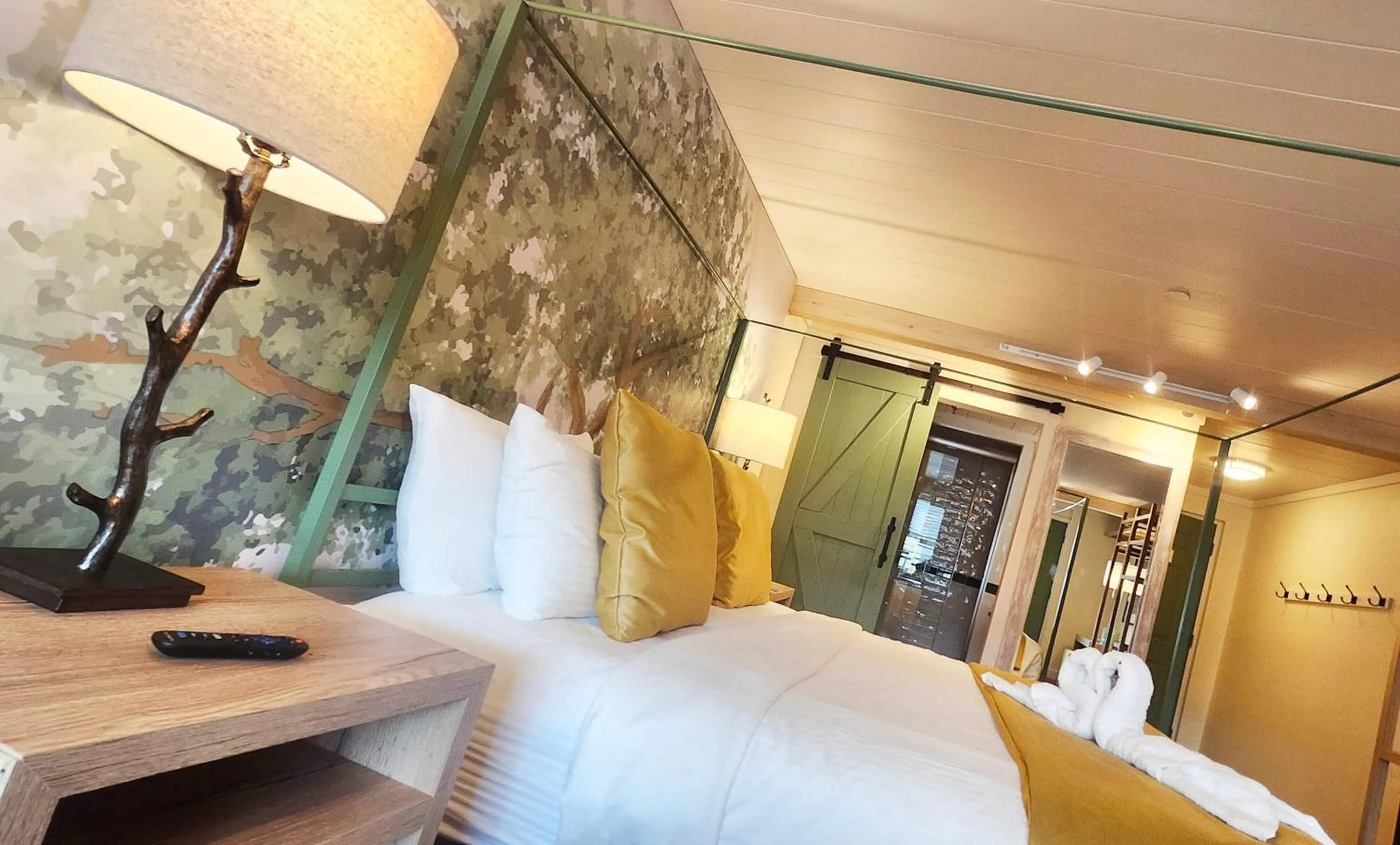 Bed in Arbors at Island Landing Hotel & Suites