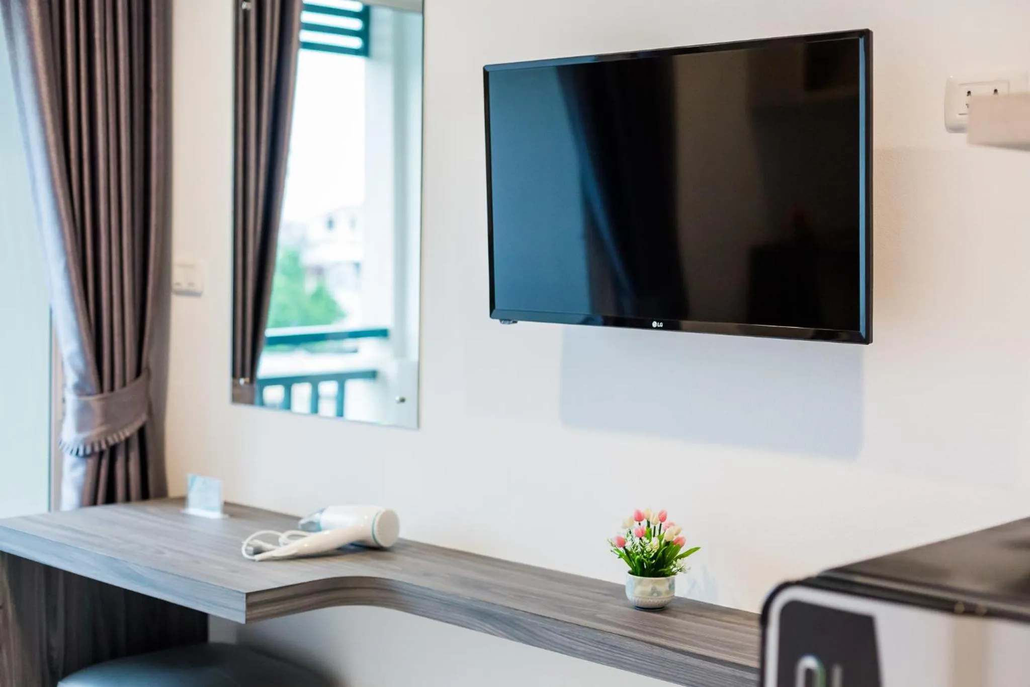 Bedroom in Evergreen Suite Hotel