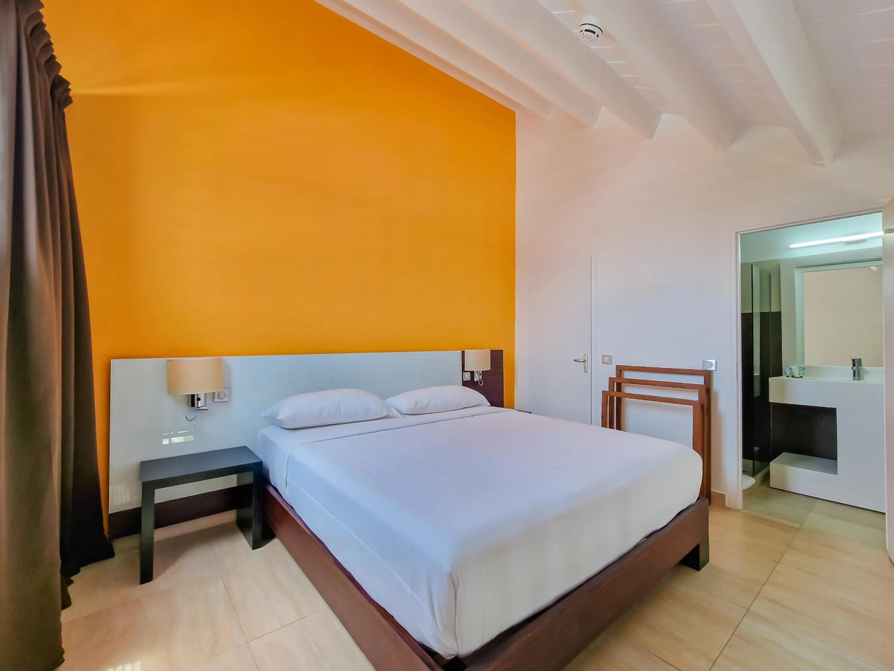 Bed in Hommage Hotel & Residences