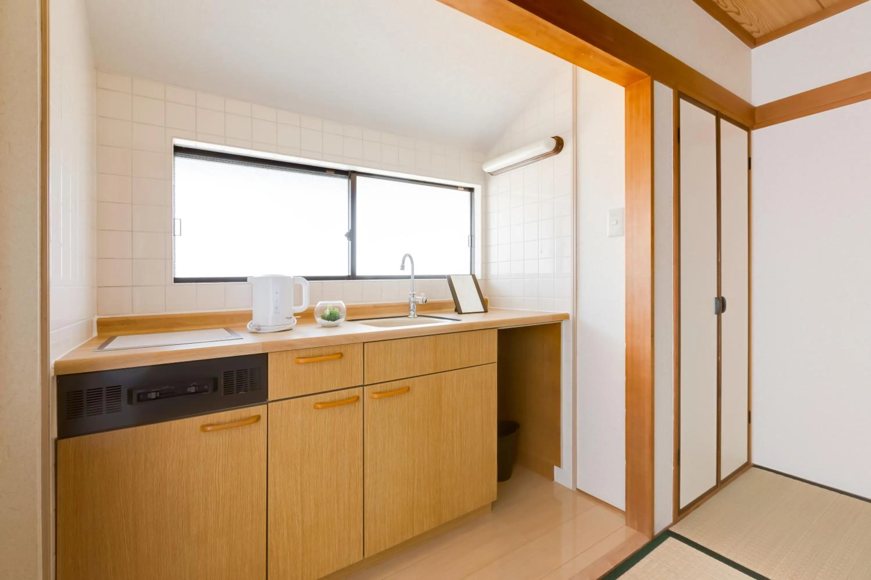 Kitchen or kitchenette in PLUS 9 Station INN