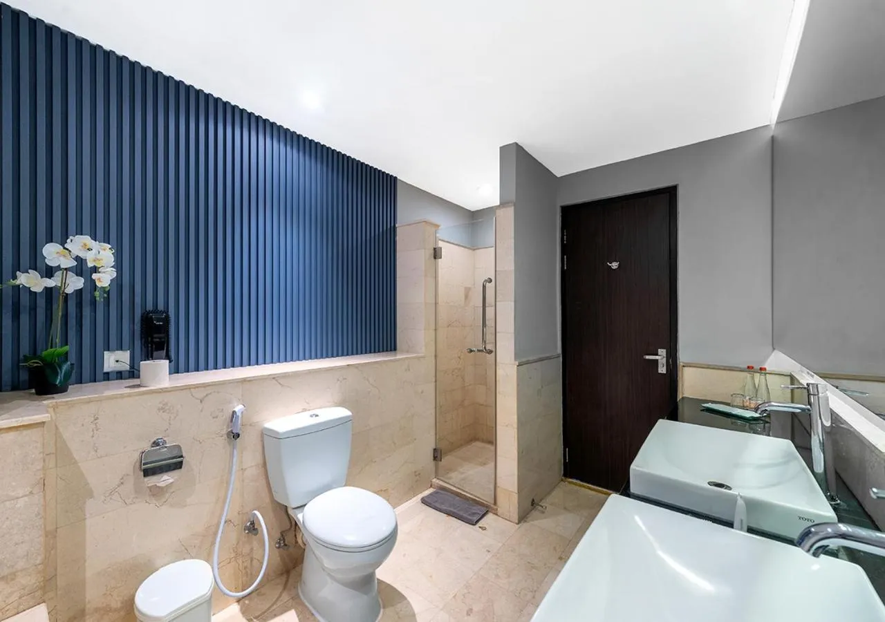 Bathroom, Bed in Oakwood Hotel & Apartments Taman Mini Jakarta