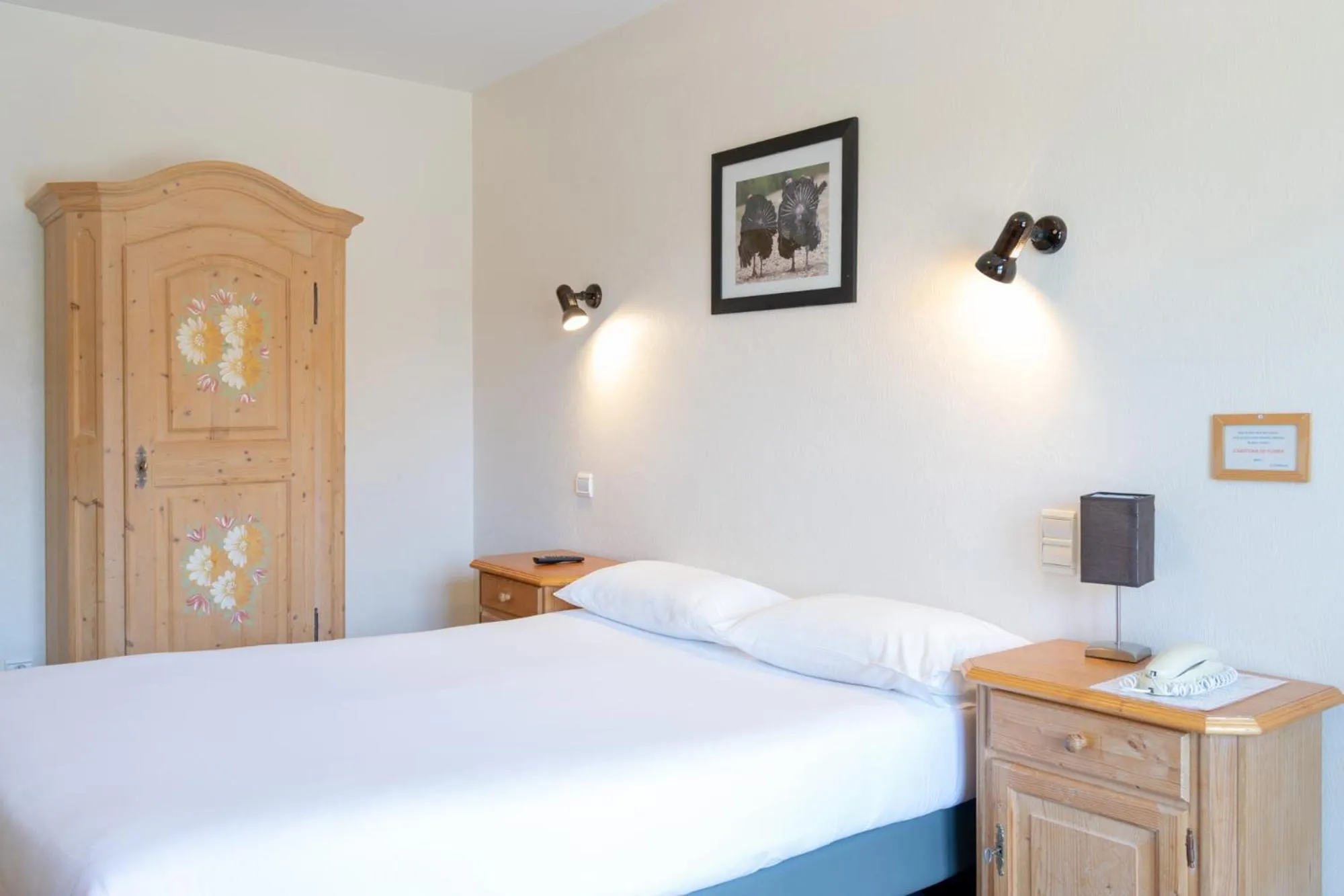 Bed in Hôtel de la Poste