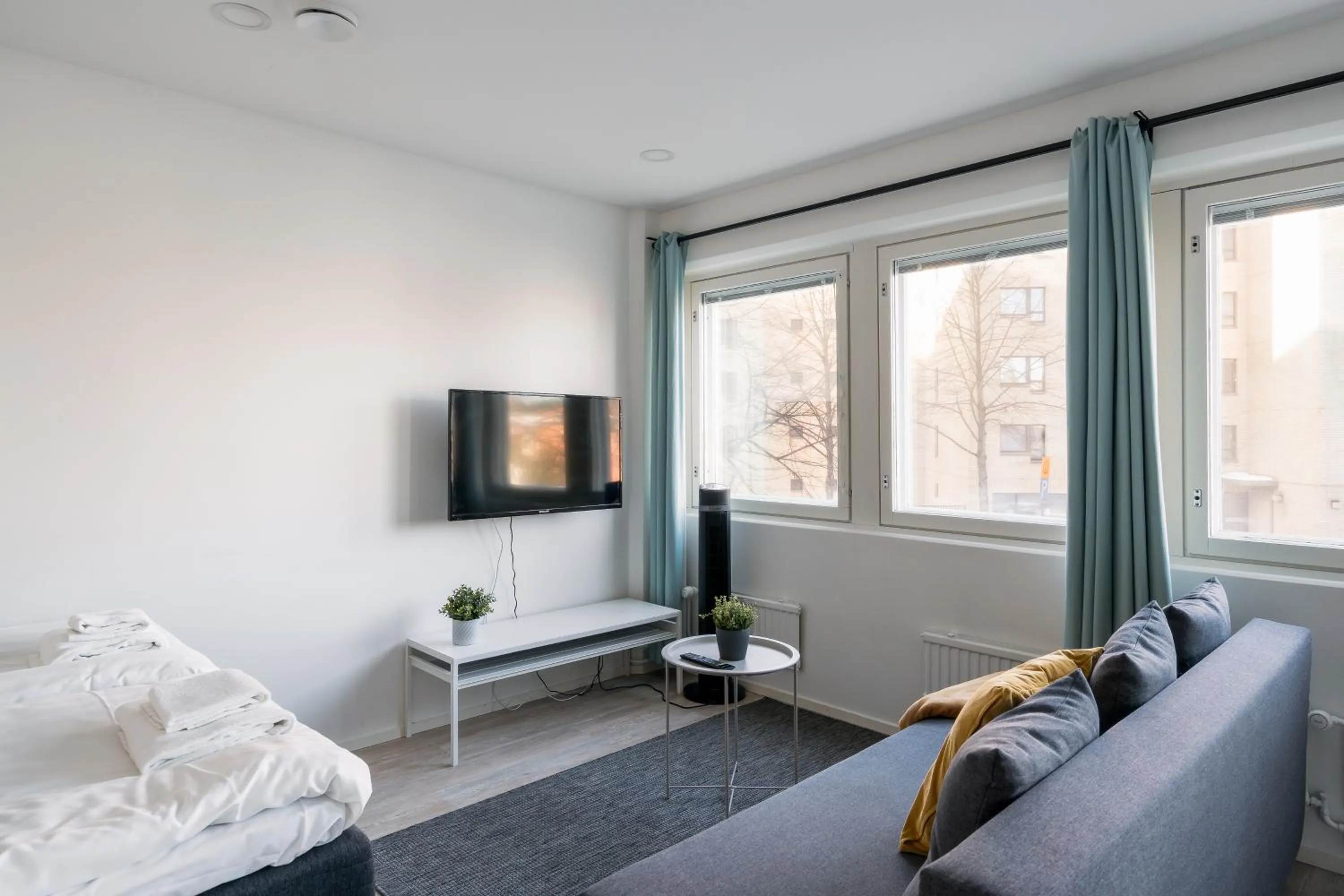 Living room, Bed in Hiisi Homes Helsinki Haaga