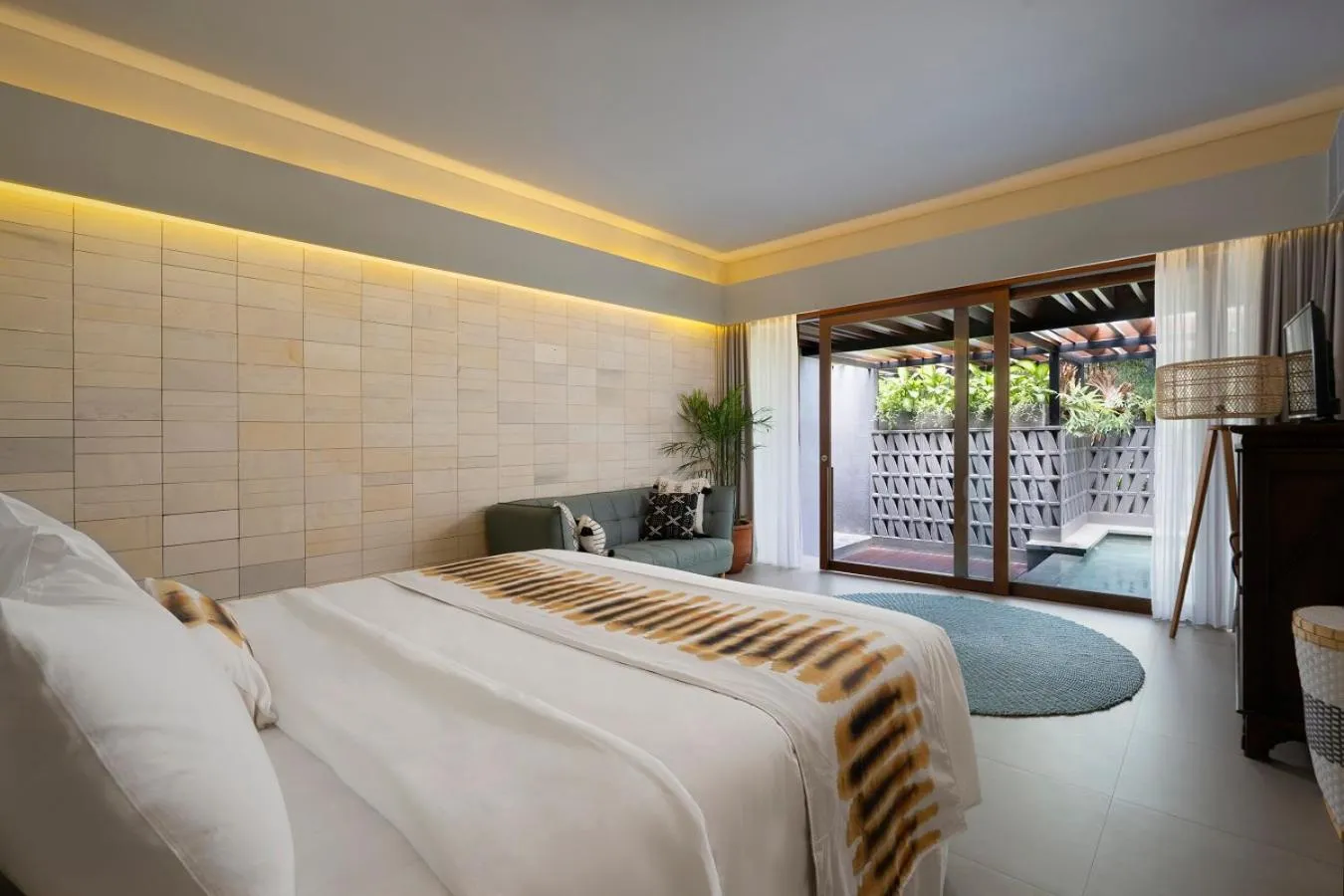 Photo of the whole room, Bed in The Kemilau Hotel & Villa Canggu Bali