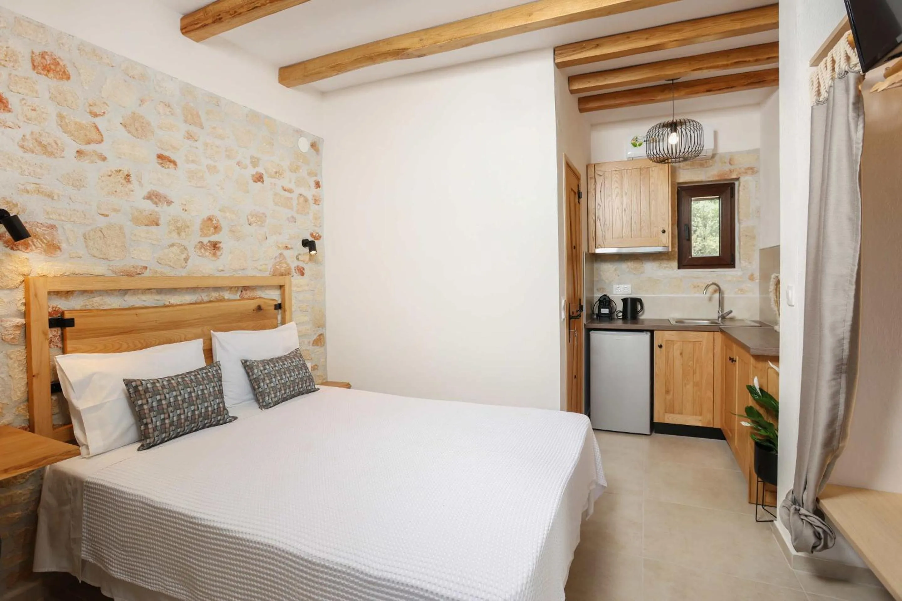 Bed in Agrielia Apartments