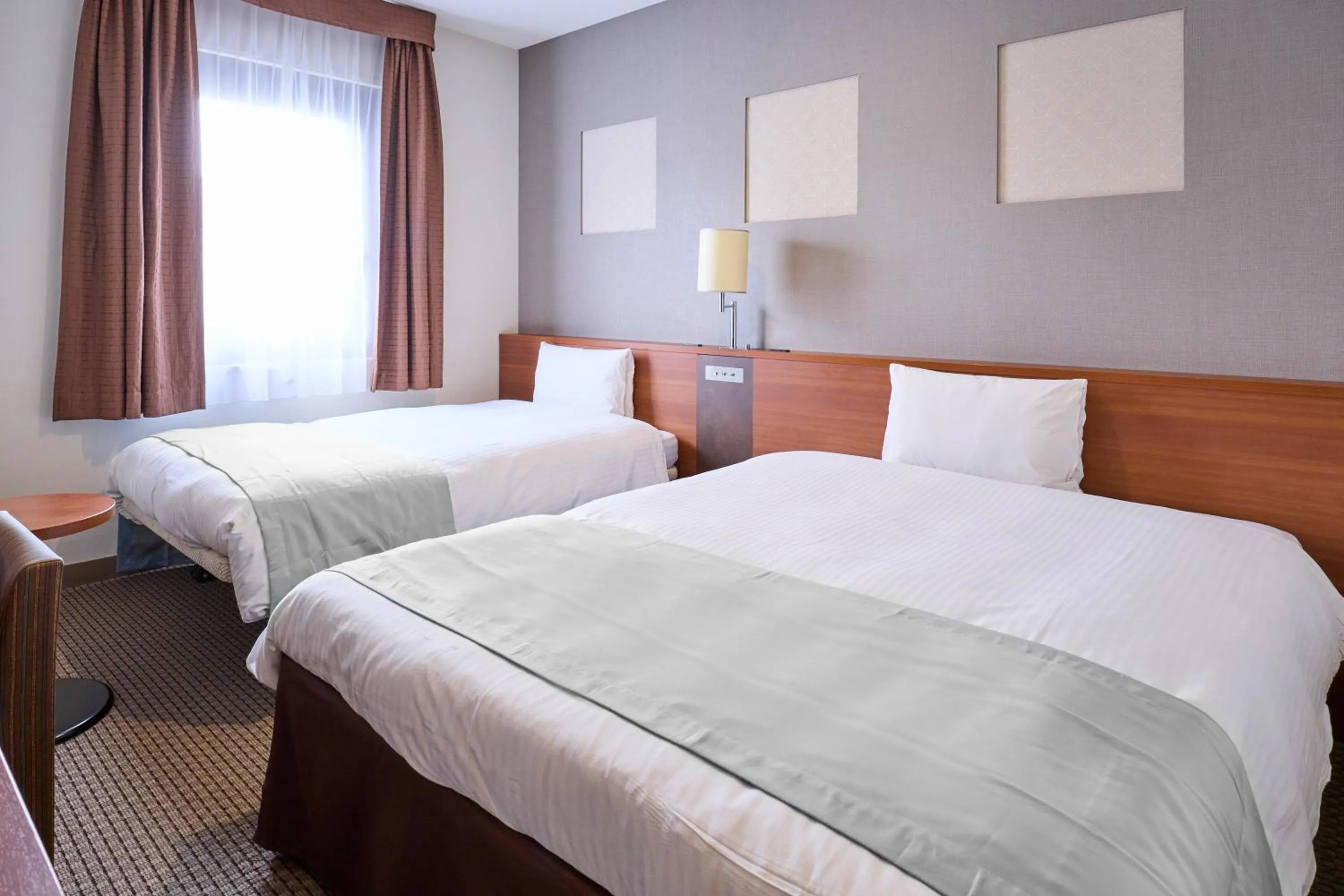 Bed in Vessel Inn Yachiyo Katsudai Station