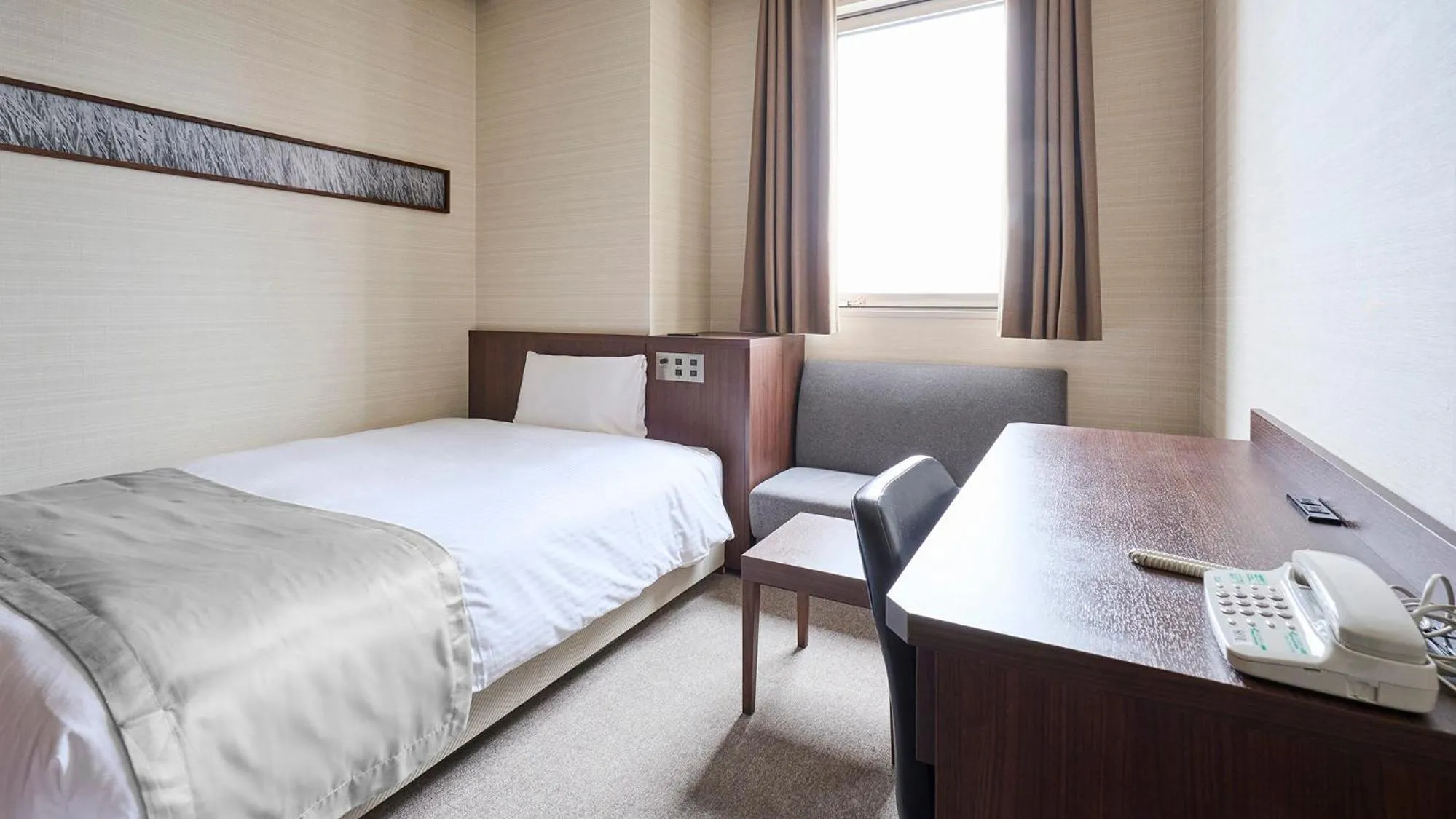 Bed in Vessel Inn Yachiyo Katsudai Station