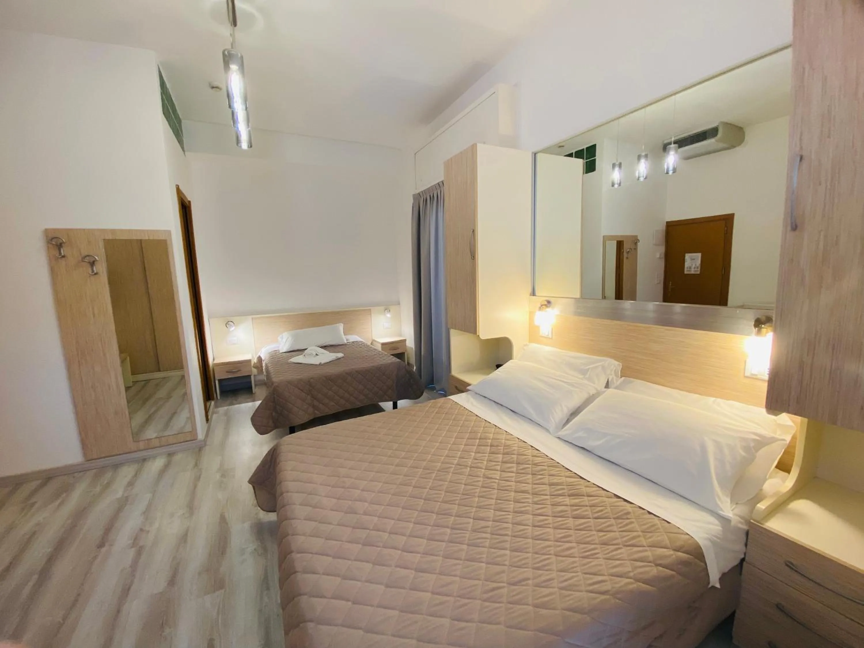 Bed in Hotel Butterfly Wellness & Spa