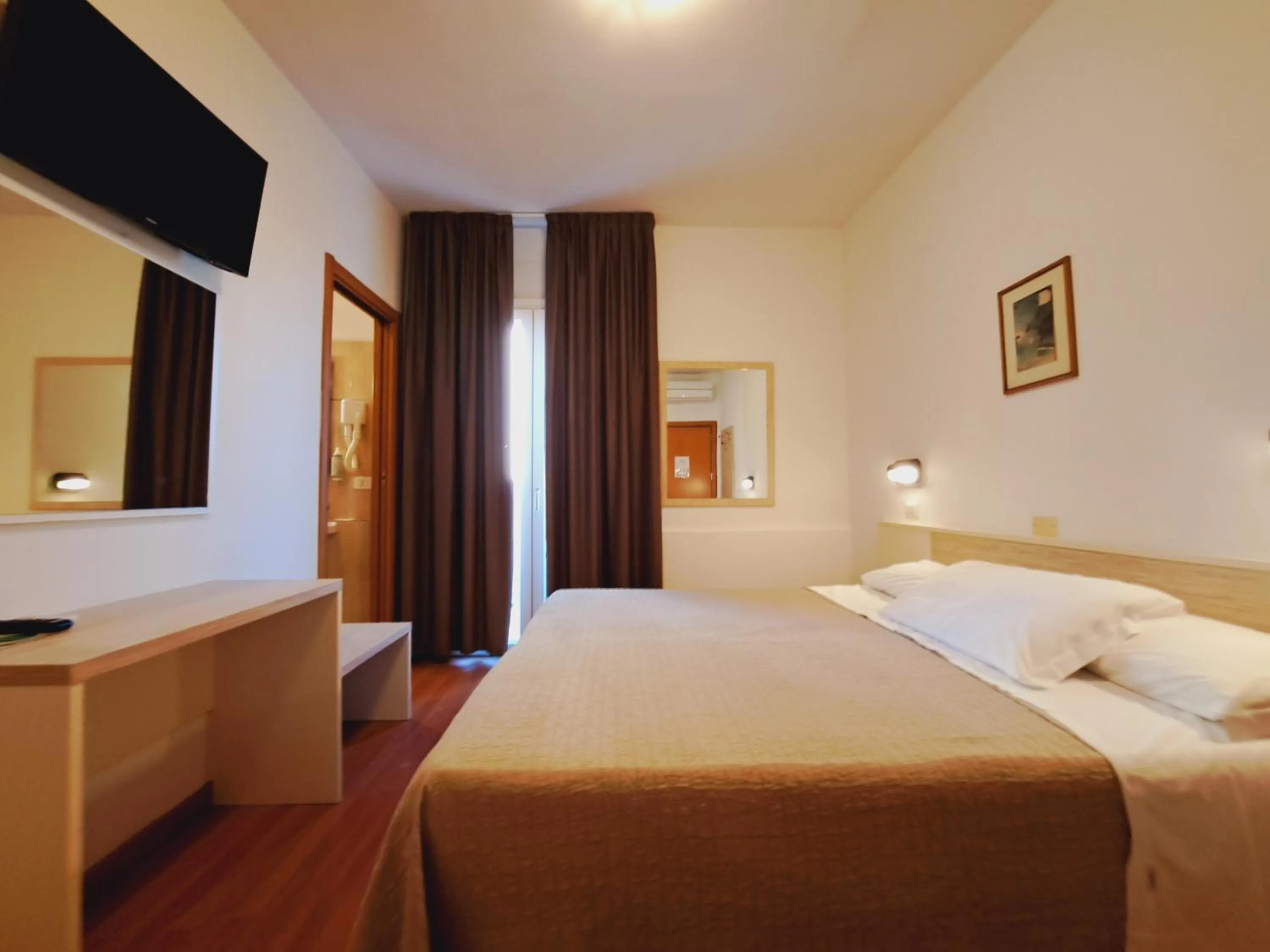 Bed in Hotel Butterfly Wellness & Spa