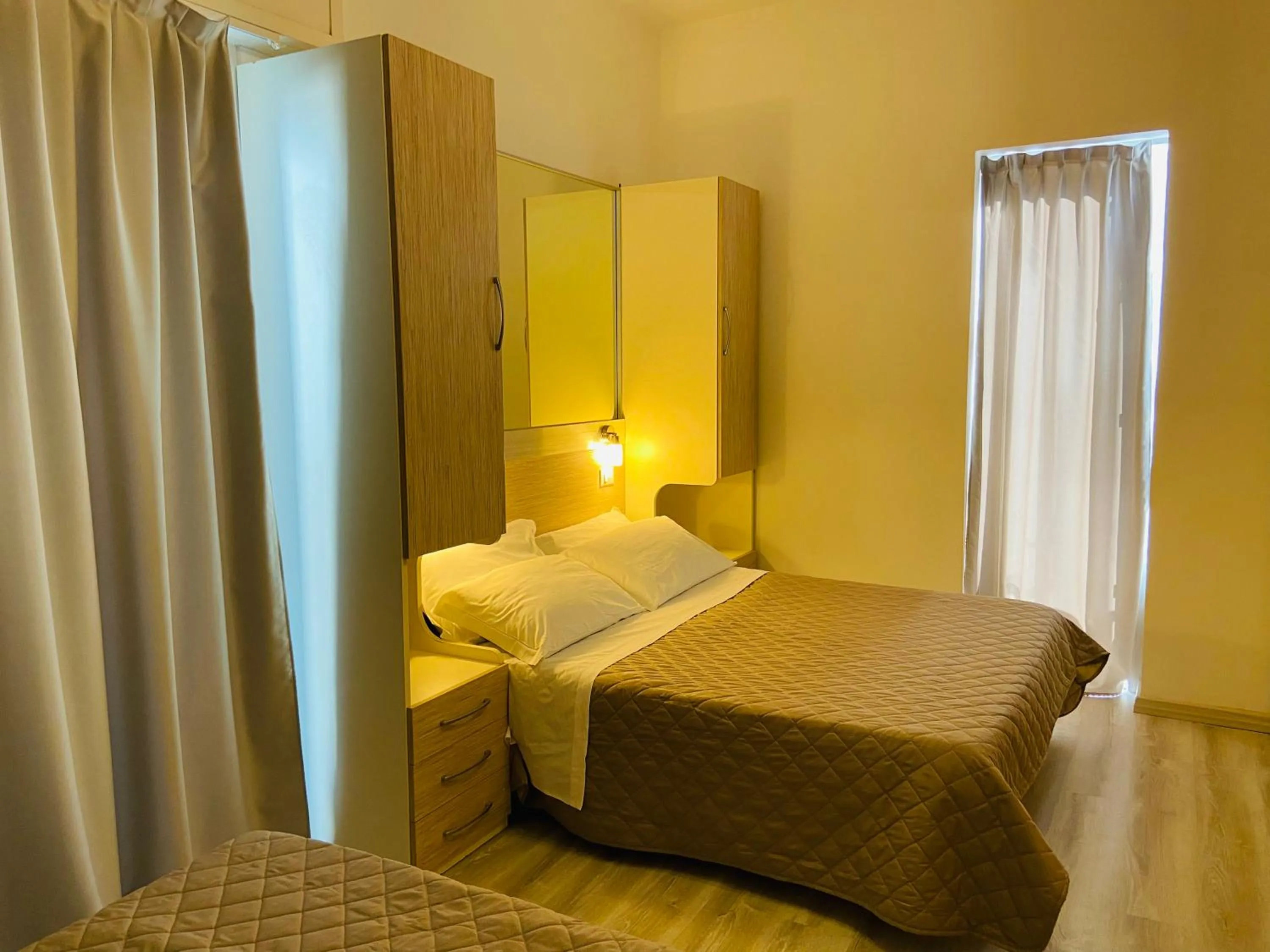 Bed in Hotel Butterfly Wellness & Spa